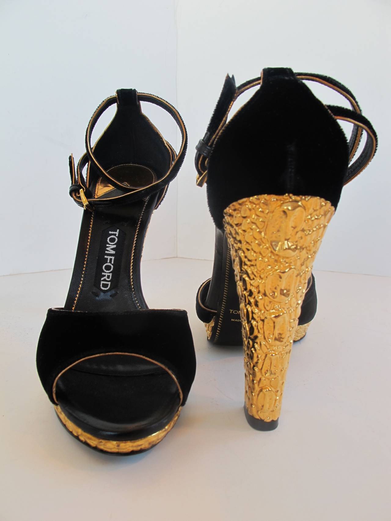 Over-the-top Tom Ford Sandals with gold metal with embossed alligator on metal. 5 inch heel. Platform 1/2 inch.