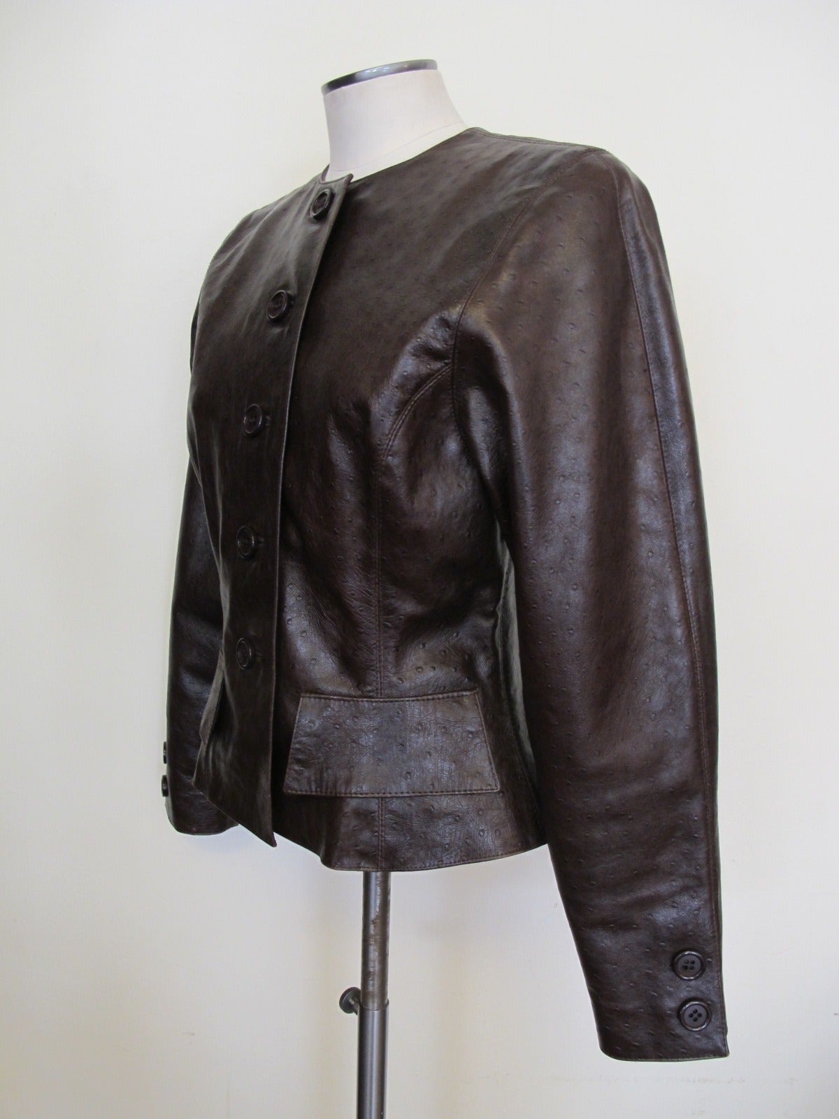 Chic Chocolate Brown Oscar de la Renta Jacket with 5 buttons. The Ostrich component contributes realty to the elegance of the look. Fabulous Piece! Shoulder to shoulder measures 14 inches.