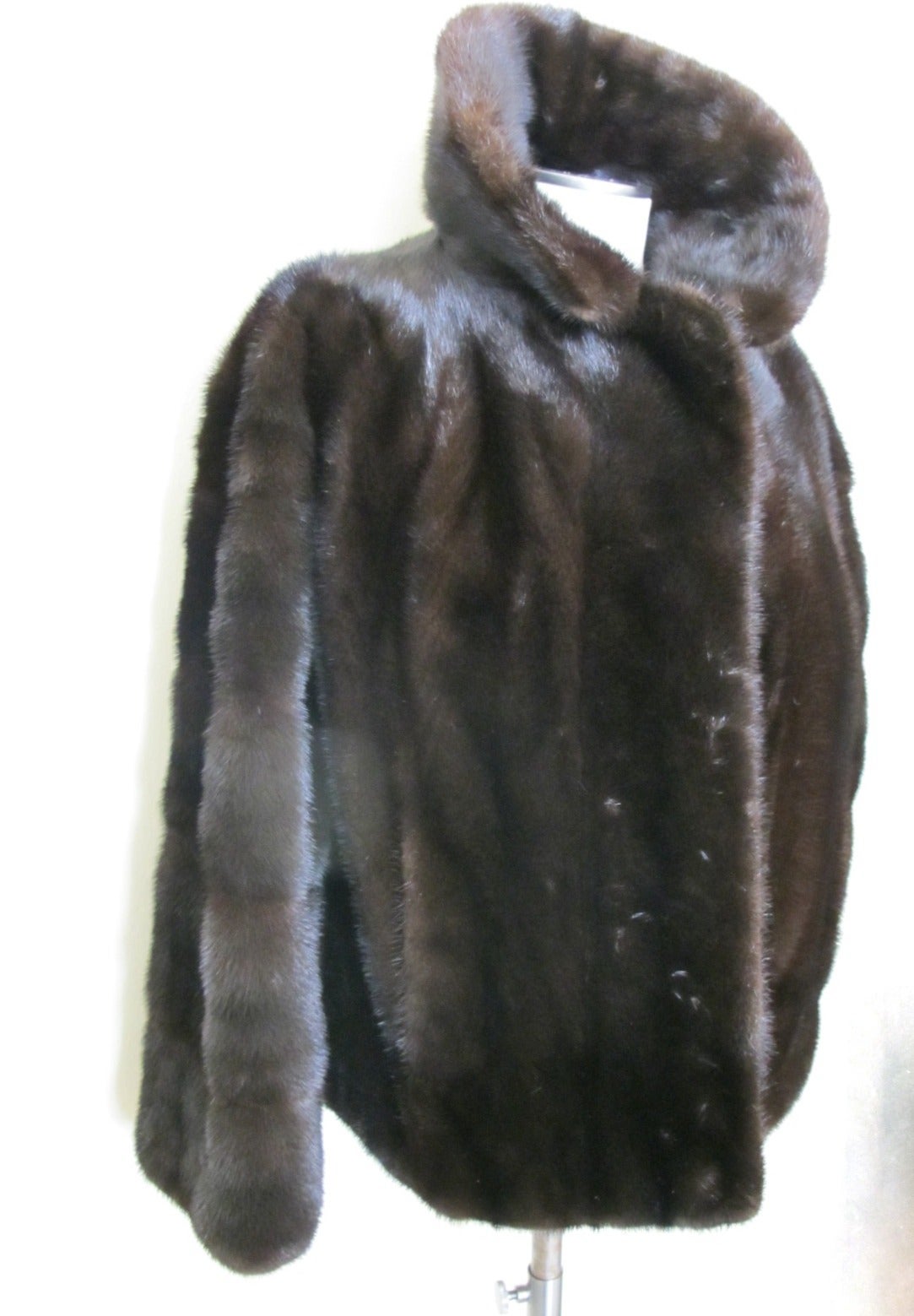 Female let out-full-hair-up Ranch Mink Jacket. Retails in 2014 for $25,000.00

There are 2 front pockets and two six inch slits of the side of the jacket. 
Sleeve Length measures 22 inches. Shoulder to shoulder measures 16 inches.
Monogram on