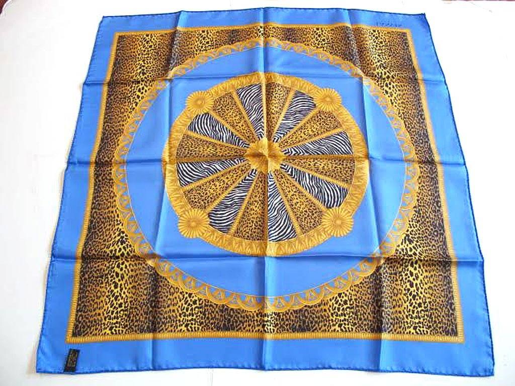 This beautiful Lanvin animal print scarf has both zebra and leopard prints within a medallion motif of vibrant blue and gold. It is 100% silk and measures 26 x 26 inches. It came to us from a grande dame estate in Hillsborough California.

* Your