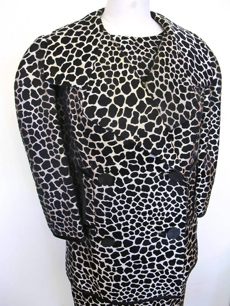 This beautiful Galanos black and white giraffe print sleeveless dress with matching jacket is in a heavy silk and is lined in silk organza. Mr. Galanos had his fabrics made to his specifications in Italy and France. The jacket is double breasted