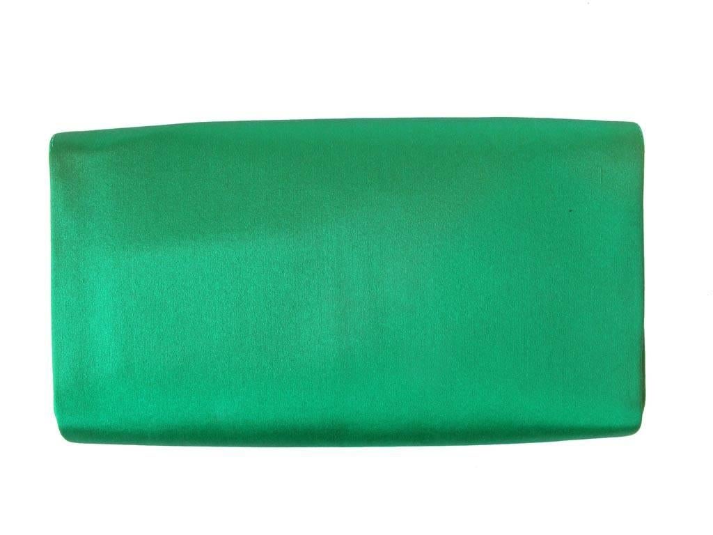 Vintage 1950's Gucci kelly green satin clutch with scallop edge and bow detail. Three pockets inside plus a zippered pocket.

YOUR PURCHASE BENEFITS THOSE WHO ARE DEVELOPMENTALLY DISABLED.