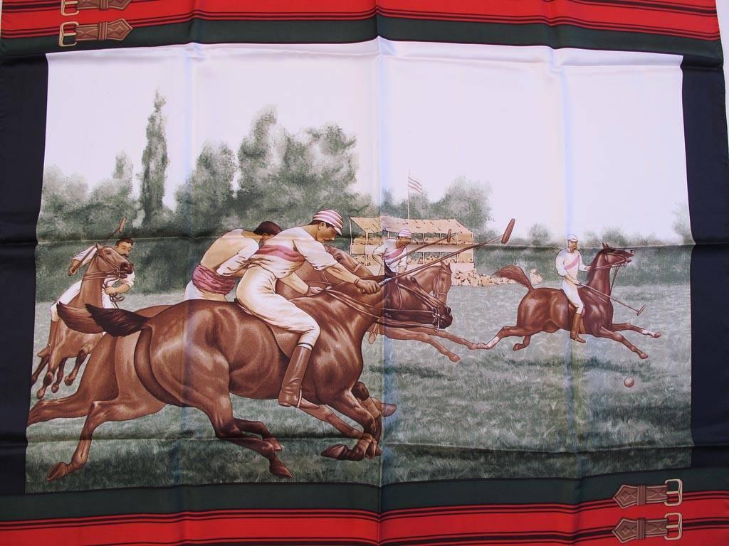 Beautiful Daniel la Forêt 100% silk print scarf depicting a polo match in red, green, black, brown and beige with buckle detailed border. Hand rolled edges.

YOUR PURCHASE BENEFITS THOSE WHO ARE DEVELOPMENTALLY DISABLED. 