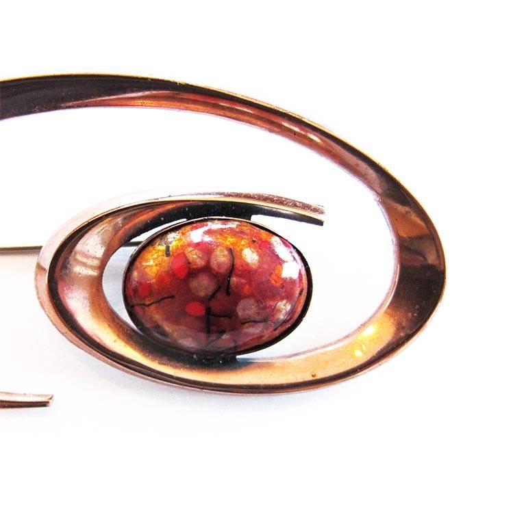 Vintage 1950's Matisse Renoir copper and enamel pin. The piece features a speckled enamel oval in the Van Gogh colors of orange, red, gold and yellow surrounded by a copper swirl.

YOUR PURCHASE BENEFITS THOSE WHO ARE DEVELOPMENTALLY DISABLED.