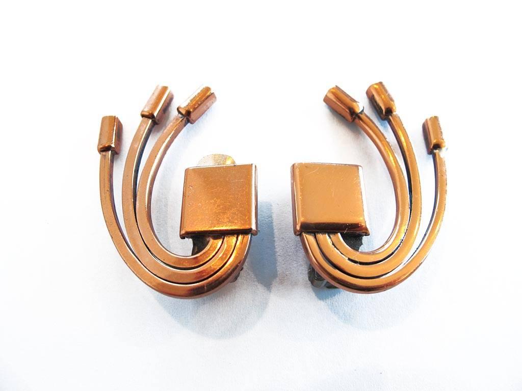 Vintage 1950's Renoir copper earrings. Modernist geometric abstract design. Clip-on style. Signed.

YOUR PURCHASE BENEFITS THOSE WHO ARE DEVELOPMENTALLY DISABLED.