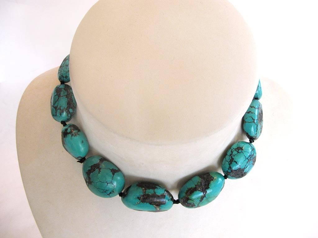 Natural genuine turquoise nugget choker necklace. The turquoise stone beads are knotted and the decorative clasp is sterling silver with hook style closure.

YOUR PURCHASE BENEFITS THOSE WHO ARE DEVELOPMENTALLY DISABLED.