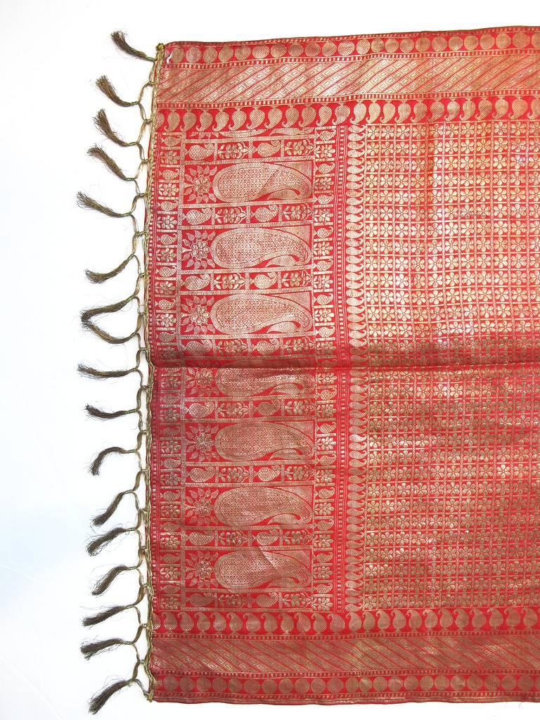 Antique brocade silk scarf hand woven with zari gold thread in a ethnic floral motif with tasseled fringe borders. From a San Francisco Grande Dame's collection.

YOUR PURCHASE BENEFITS THOSE WHO ARE DEVELOPMENTALLY DISABLED.
