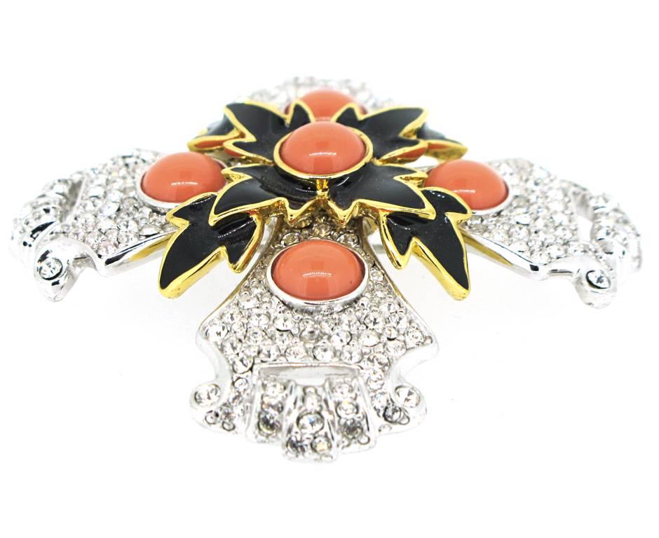 Beautiful Kenneth Jay Lane large pave set rhinestone encrusted Maltese cross with faux coral cabochons and black enamel. The brooch doubles as a pendant and measures 3