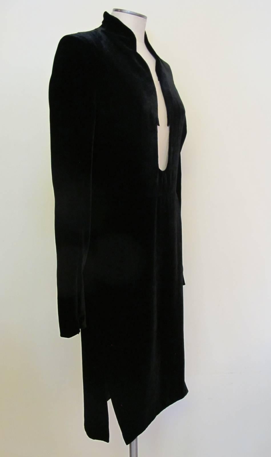 Elegant black velvet cocktail dress with flesh netting. There is a 19.5 inch drop in the back of the dress engaging the 