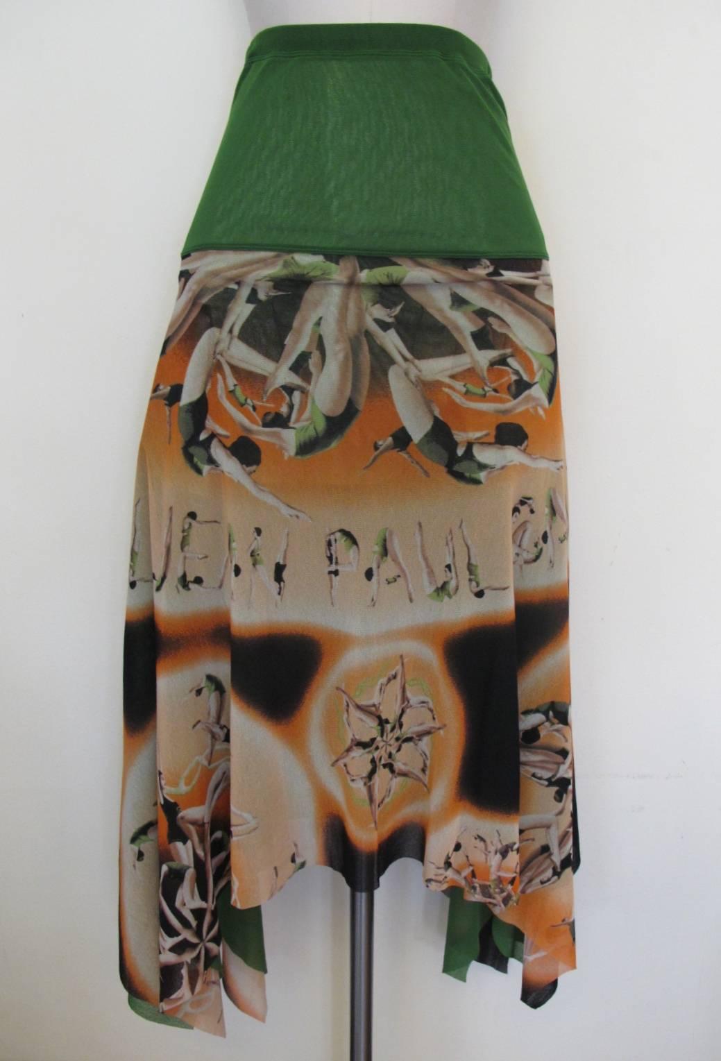 Fabulous strapless dress or skirt with women acrobatic design by Jean Paul Gaultier - Soleil. The skirt is cut on the bias with a fabulous asymmetrical skirt. The color scheme is kelly green, orange and dark chocolate brown. Fabric is super -
