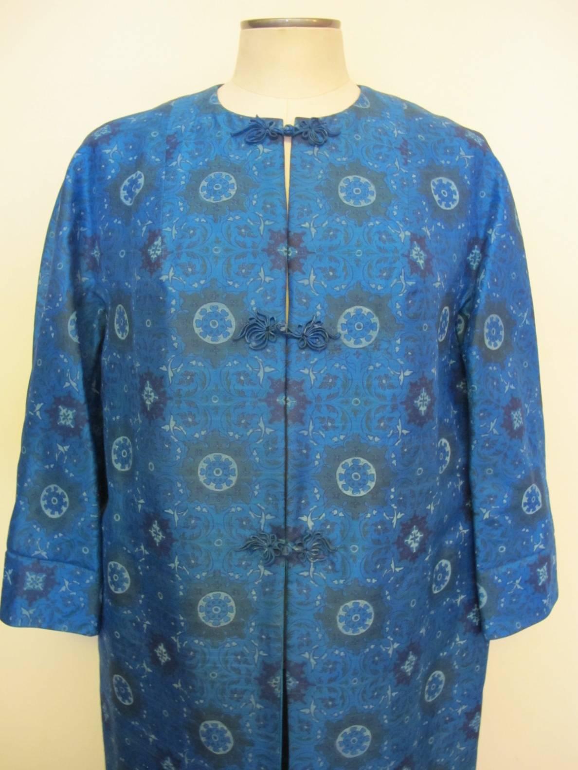 The patterned coat has three frogs. The solid Turquoise Blue Coat has no frogs. There are four pockets - 2 pockets for each design. The coat fits the body perfectly and it has a continuous sleeve. A lovely knotted belt can be worn on the waist. Fits