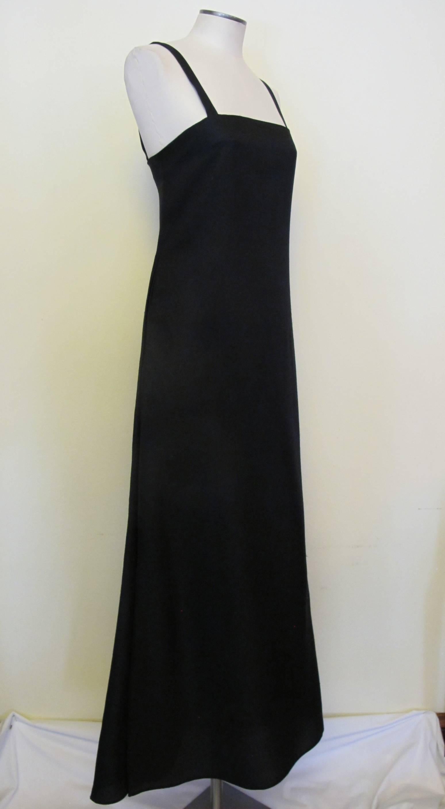 The feel of Audrey Hepburn's iconic style is inherent in this elegant, black silk bazar evening gown. It is symbolic of the effortless style of Miss Hepburn which remains classic and the epitome of sophistication. 