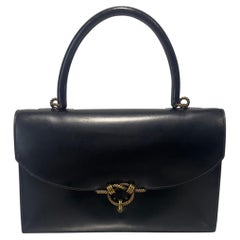 Vintage Hermès black leather bag with a La Cordelière clasp