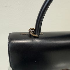 Vintage Hermès black leather bag with a La Cordelière clasp