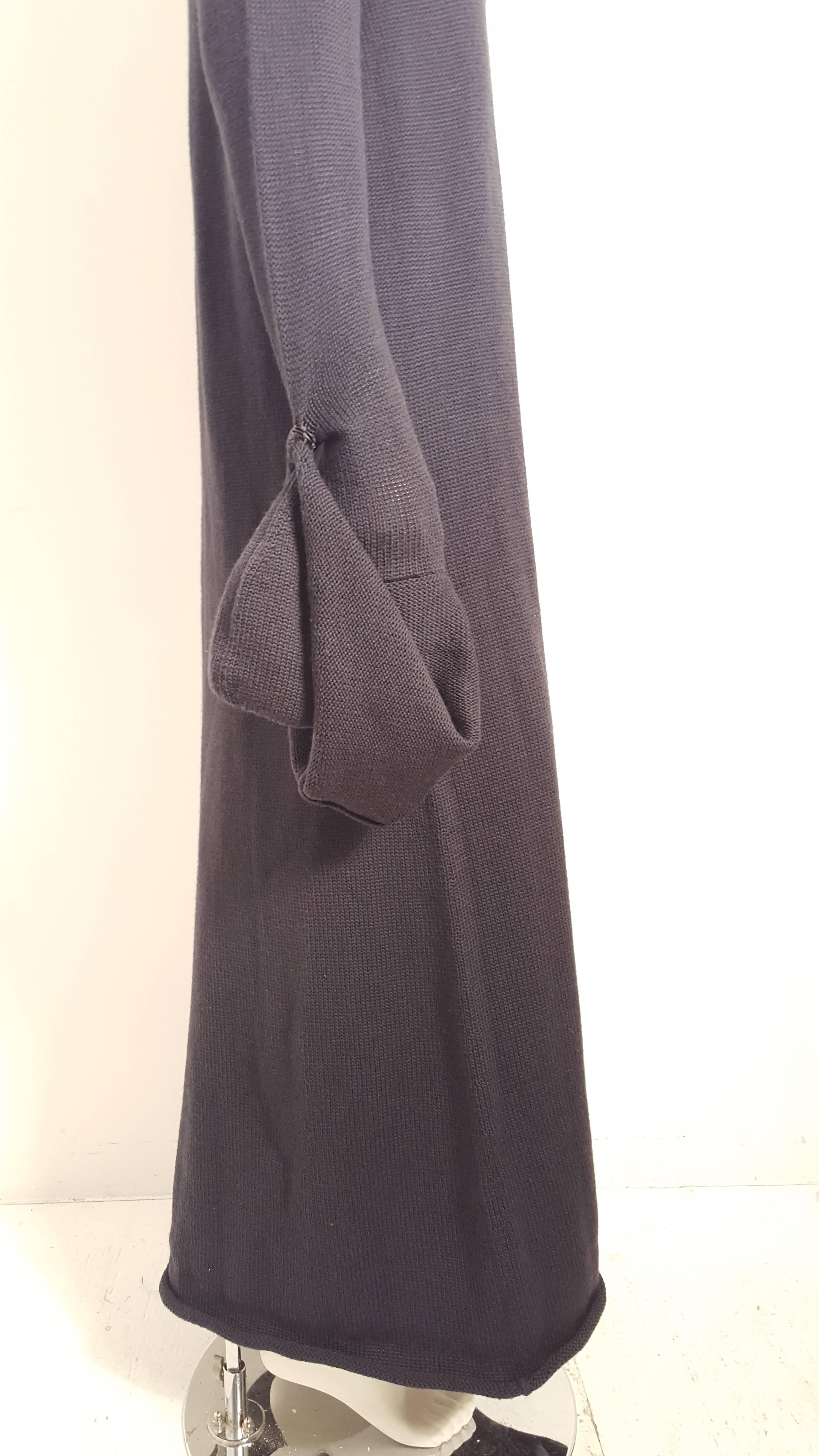 Yohji Yamamoto 1990's navy sweater dress has dumbbell sleeves featuring an adjustable snap button closure- exaggerating the length of the sleeve from 27'' x  9'' wide and the collar is 11