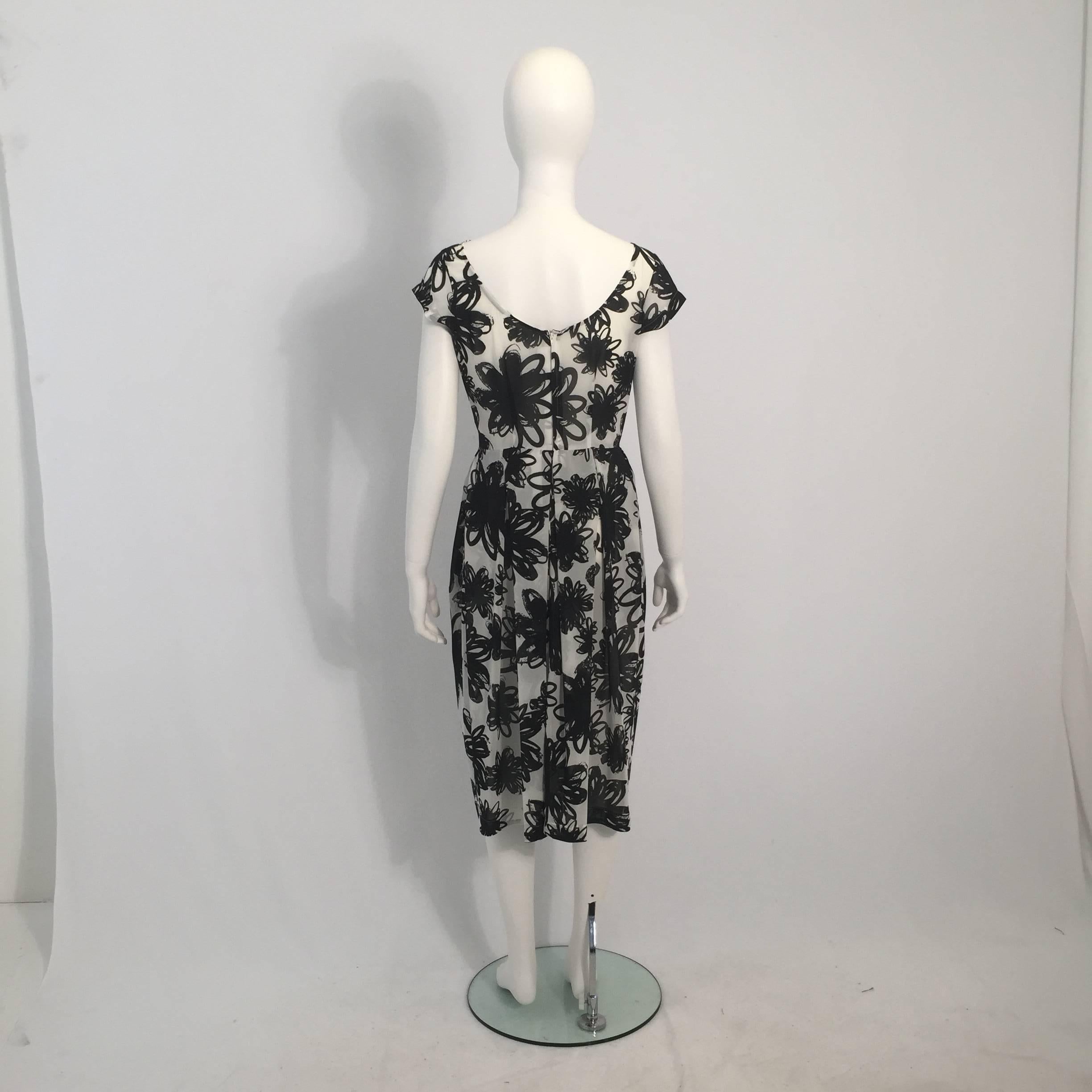 Comme des Garçons 1990's black and white, abstract floral-print, dress.

For International orders, please contact us for a shipping quote.
