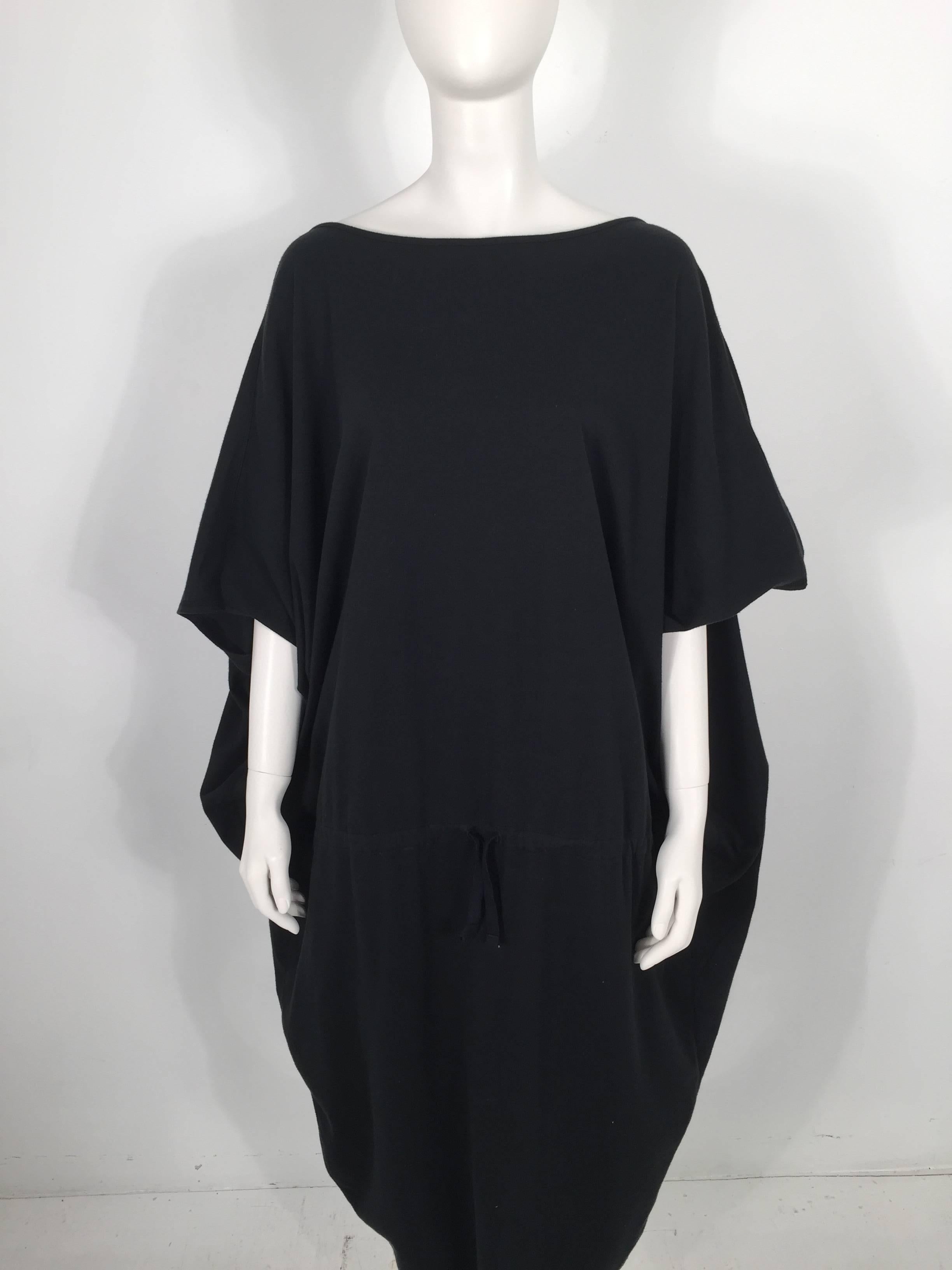 Issey Miyake 1980's black balloon dress is 100% Cotton.

Measurements: Sleeves: 12''; Front slit: 9.5''

For International orders, please contact us for a shipping quote.