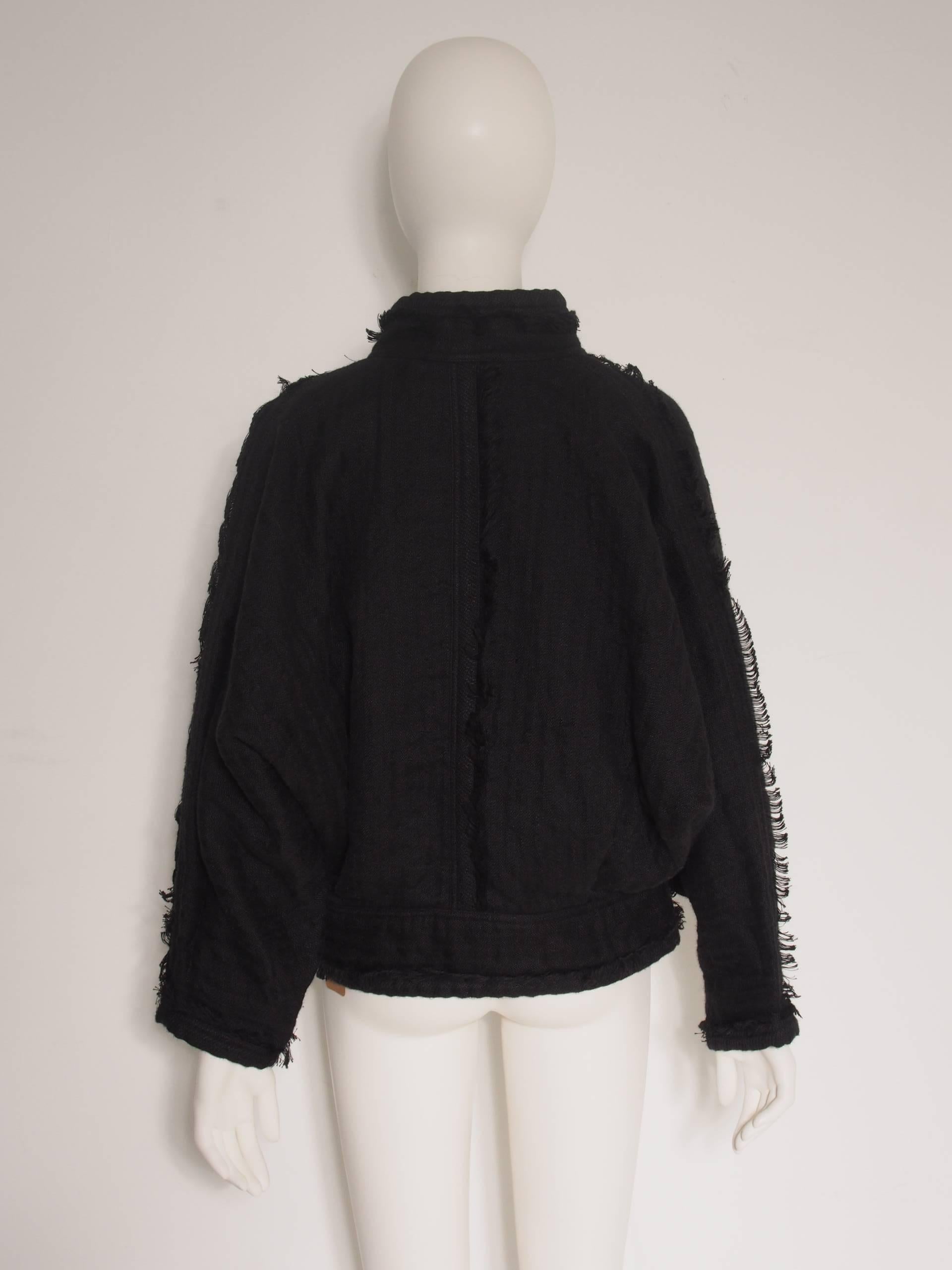 Iconic 1980s batwing woven jacket, button closures, and distressed hems.
