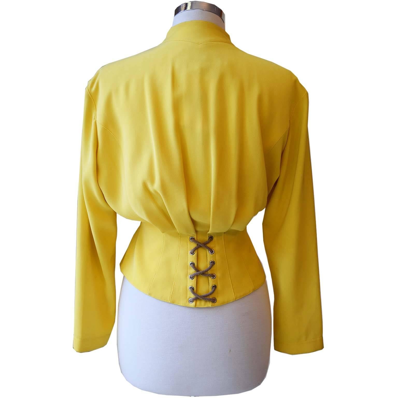 Thierry Mugler iconic canary yellow jacket with criss-cross rope detail on shoulders, front, & back. Snap button closure. Vintage Mugler from 1990s was showcased heavily on Kim Catrall's character, Samantha Jones in 'Sex & the city'. Loose upperbody