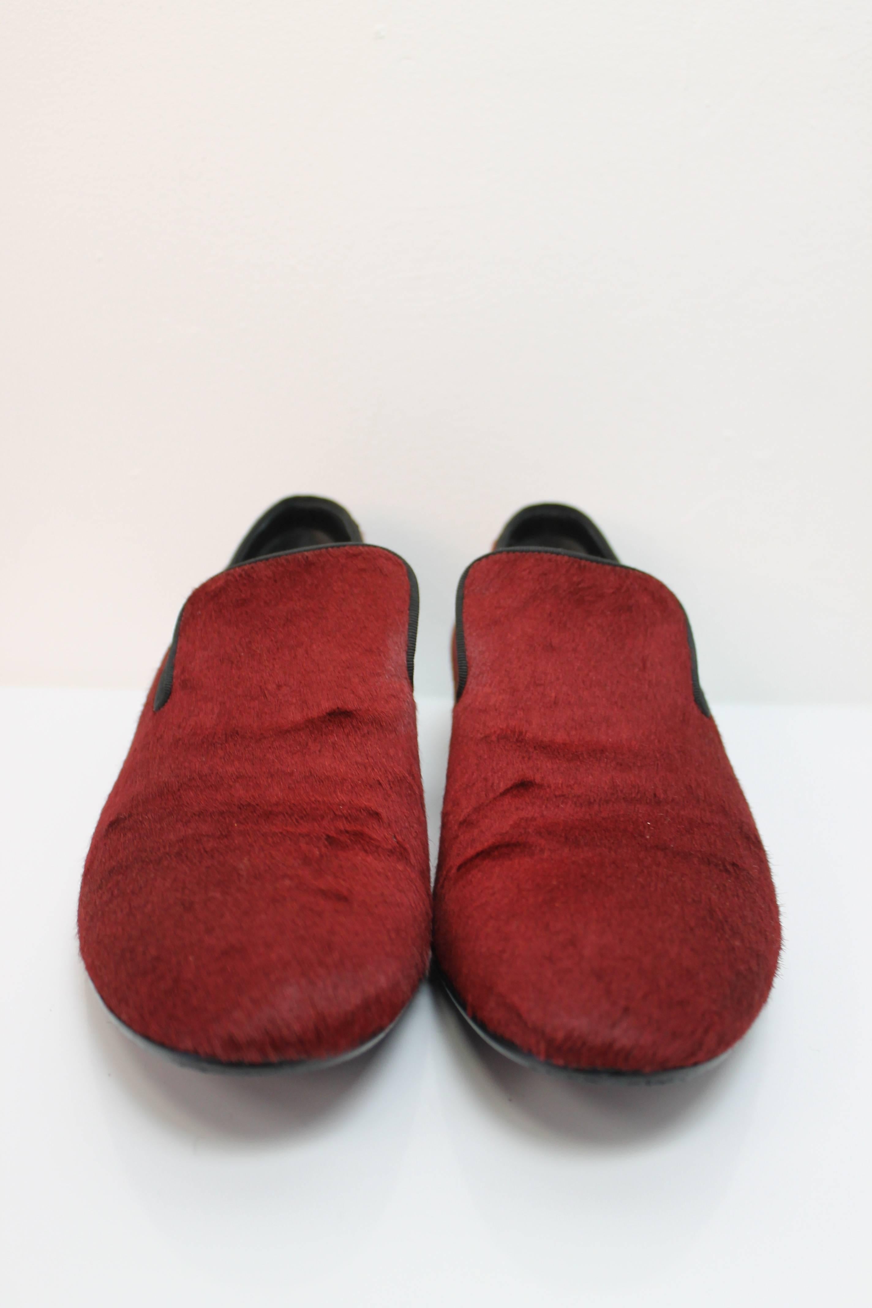 Beautiful red loafers by Celine. Features a low heels and pony-hair throughout.