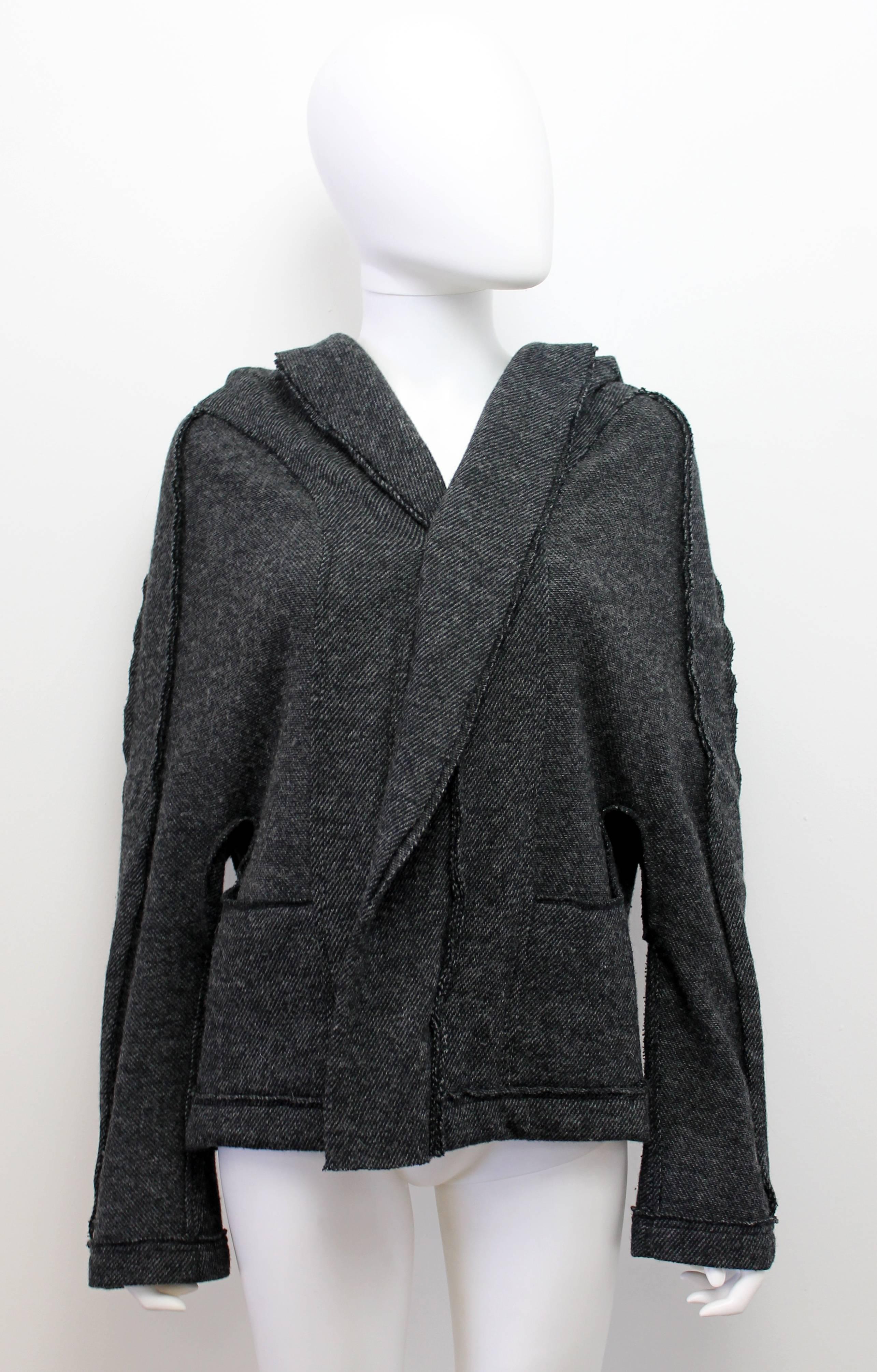 A fantastic hooded knit jacket by Yohji Yamamoto's Y's line. This piece features inverted seams and two front pockets.