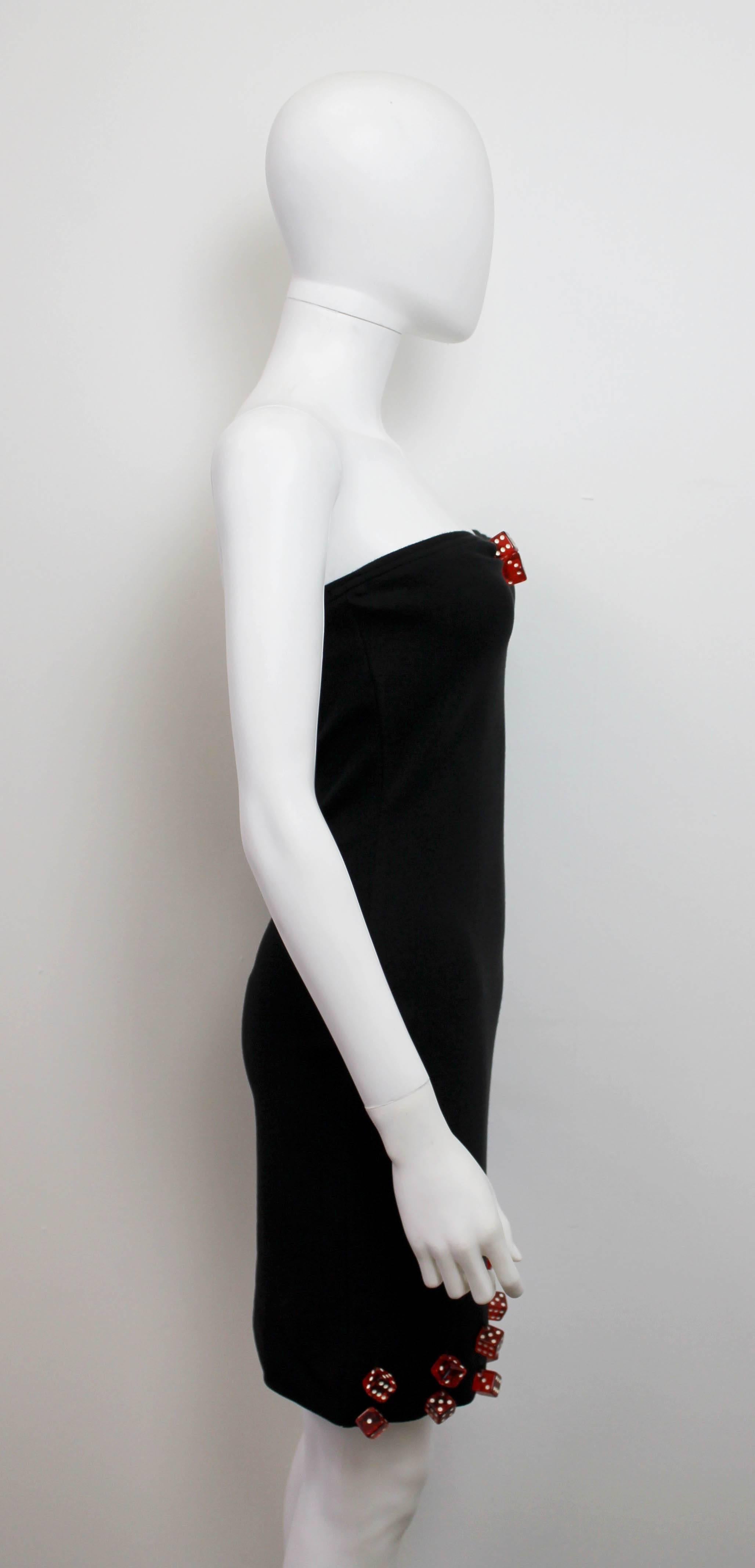 Iconic mini dress by Patrick Kelly from 1988. Features red dice details and a mini tube shape.