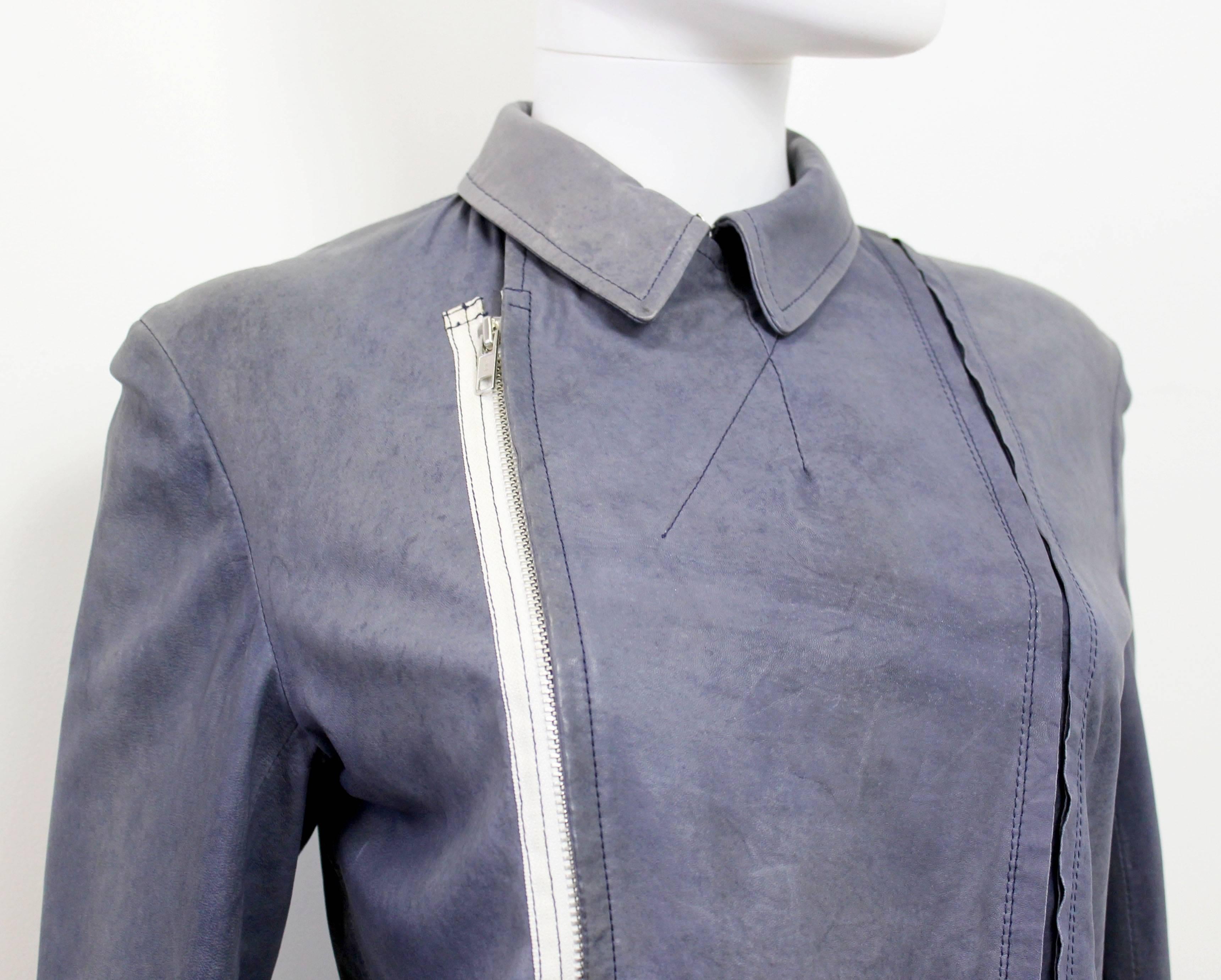 A beautiful goat skin jacket by Comme des Garcons. The jacket features exposed edge details and a white zipper.