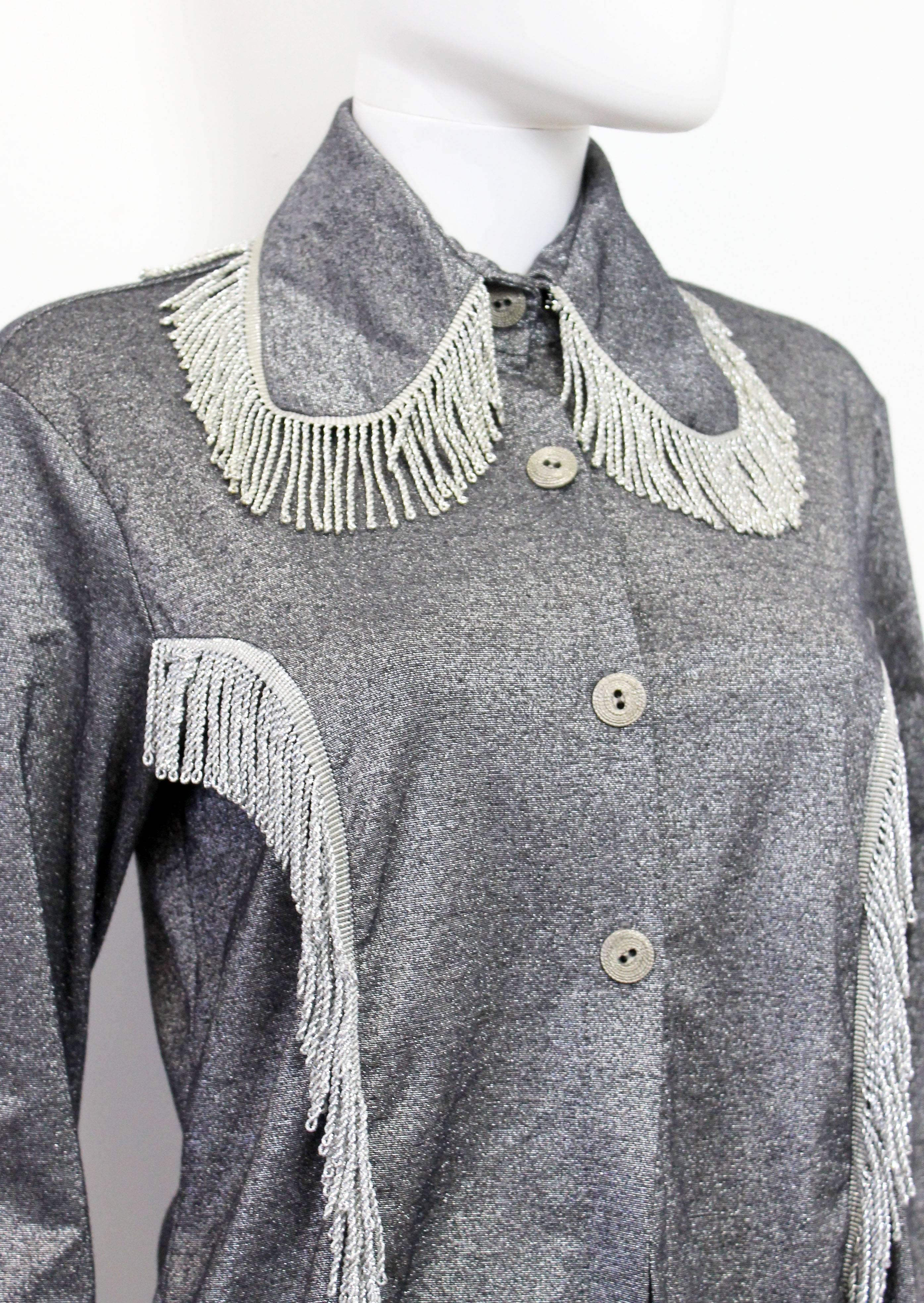 A great piece by Pam Hogg from the late 1980's. The shirt features fringe on the dog-ear collar, sleeve cuffs and princess seams. 