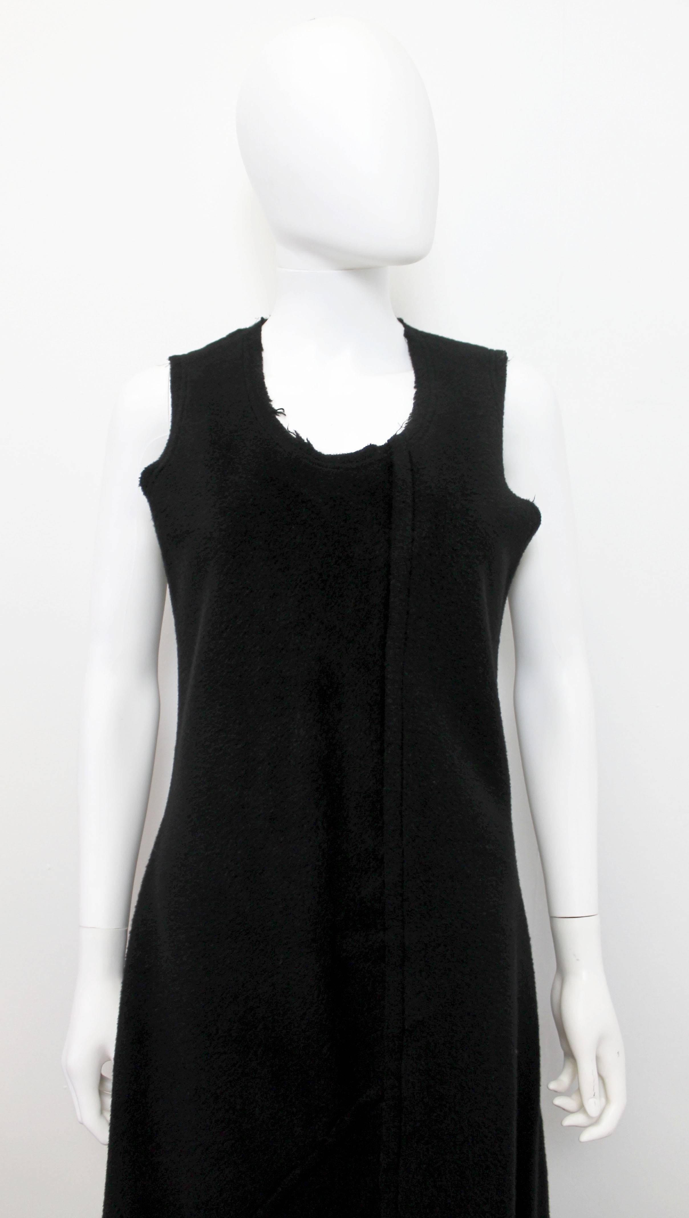 A classic piece by Comme des Garcons. c.1993

The dress features an a-symmetric cut with an a-line shaped skirt and frayed seams and neckline.

This dress is so simple and easy to wear. 