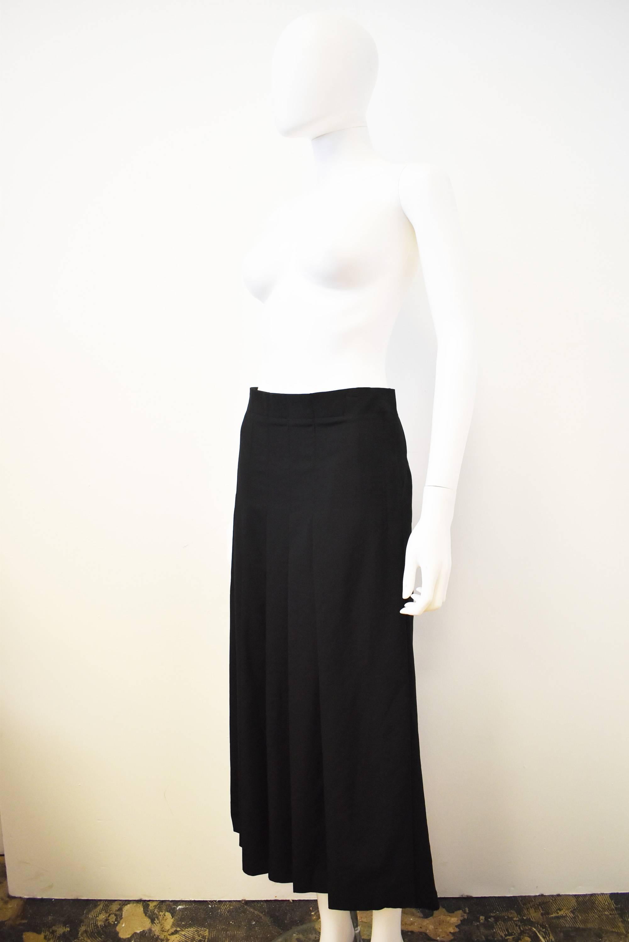A simple black skirt from Y’s by Yohji Yamamoto. The skirt has an ankle length A-line shape with a pleated front panel that attaches with a zip fastening at the side. 
The skirt is a Japanese size 3 but comes up quite small. Please see the