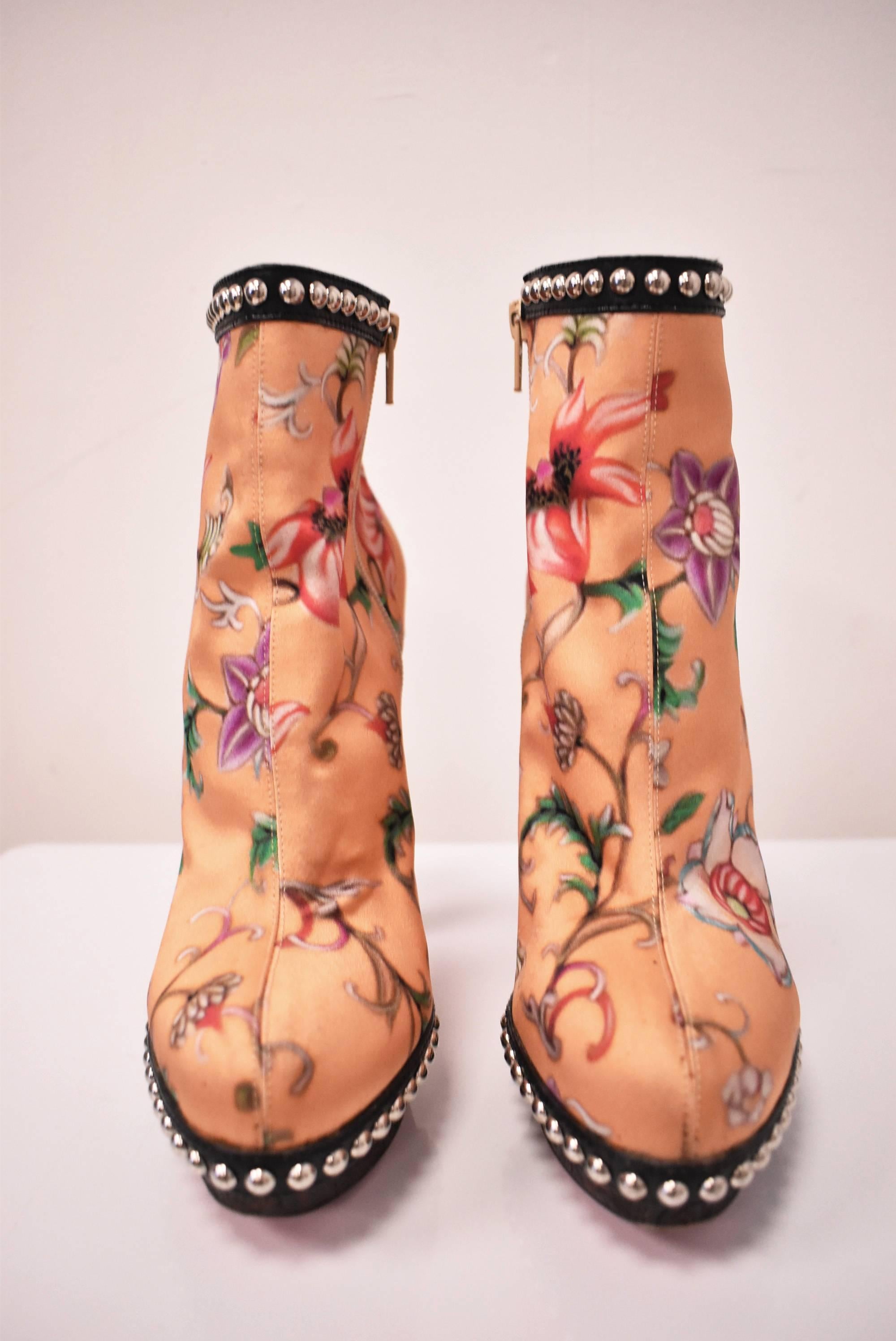 A pair of extremely rare Christian Louboutin for Mary Katrantzou Orange Floral Boot Heels from the Autumn/Winter 2011 ready to wear collection. The shoes are made from Katrantzou’s digitally printed floral orange silk that was used throughout the