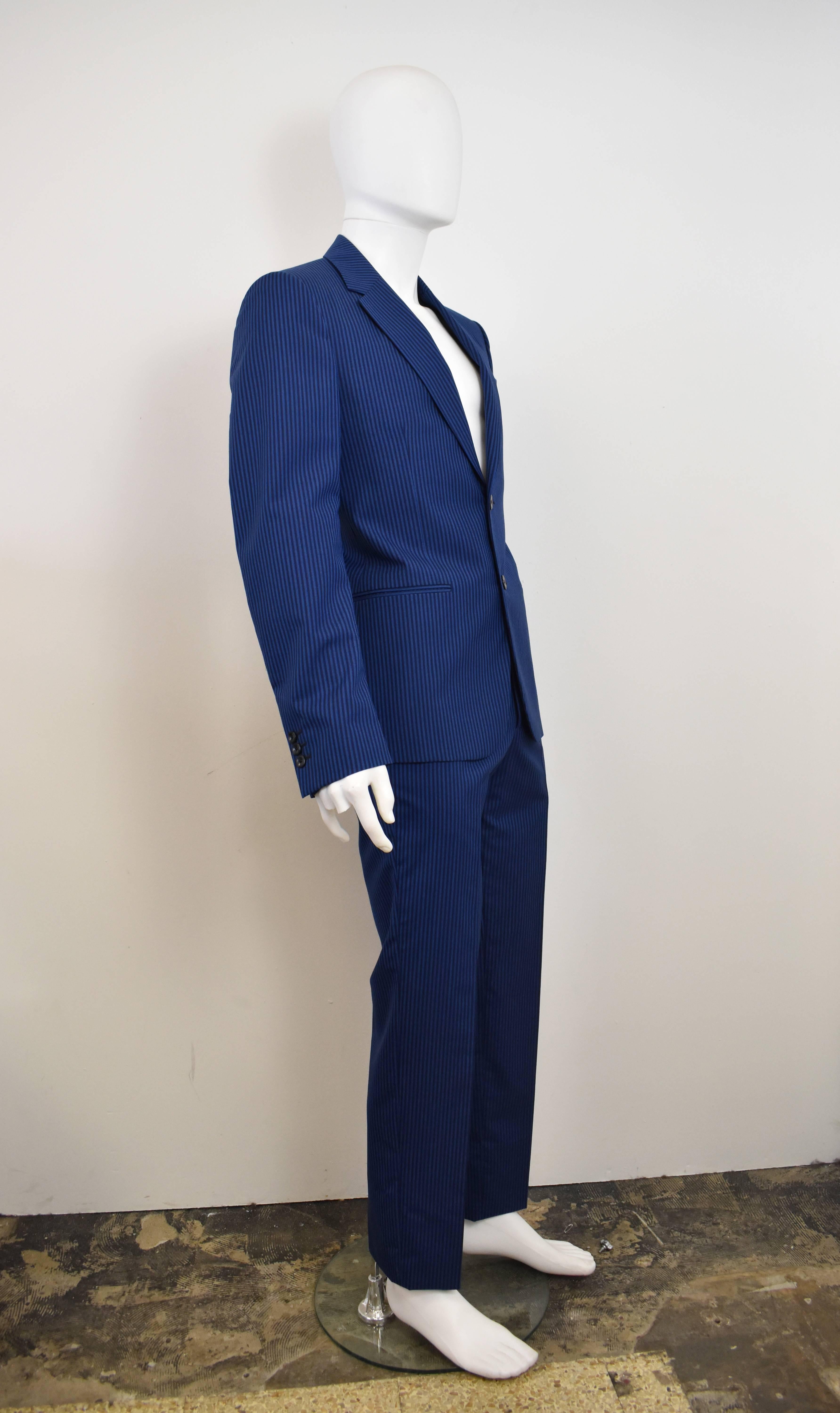 Alexander McQueen Peacock Blue and Navy Stripe Suit from S/S15 collection. 
In excellent condition, 100% wool. A striking blue – great alternative to the classic navy suit. Slim-fit. 


JACKET
Length - 29.5
Bust - 40
Waist - 36
Hips - 39
Sleeve