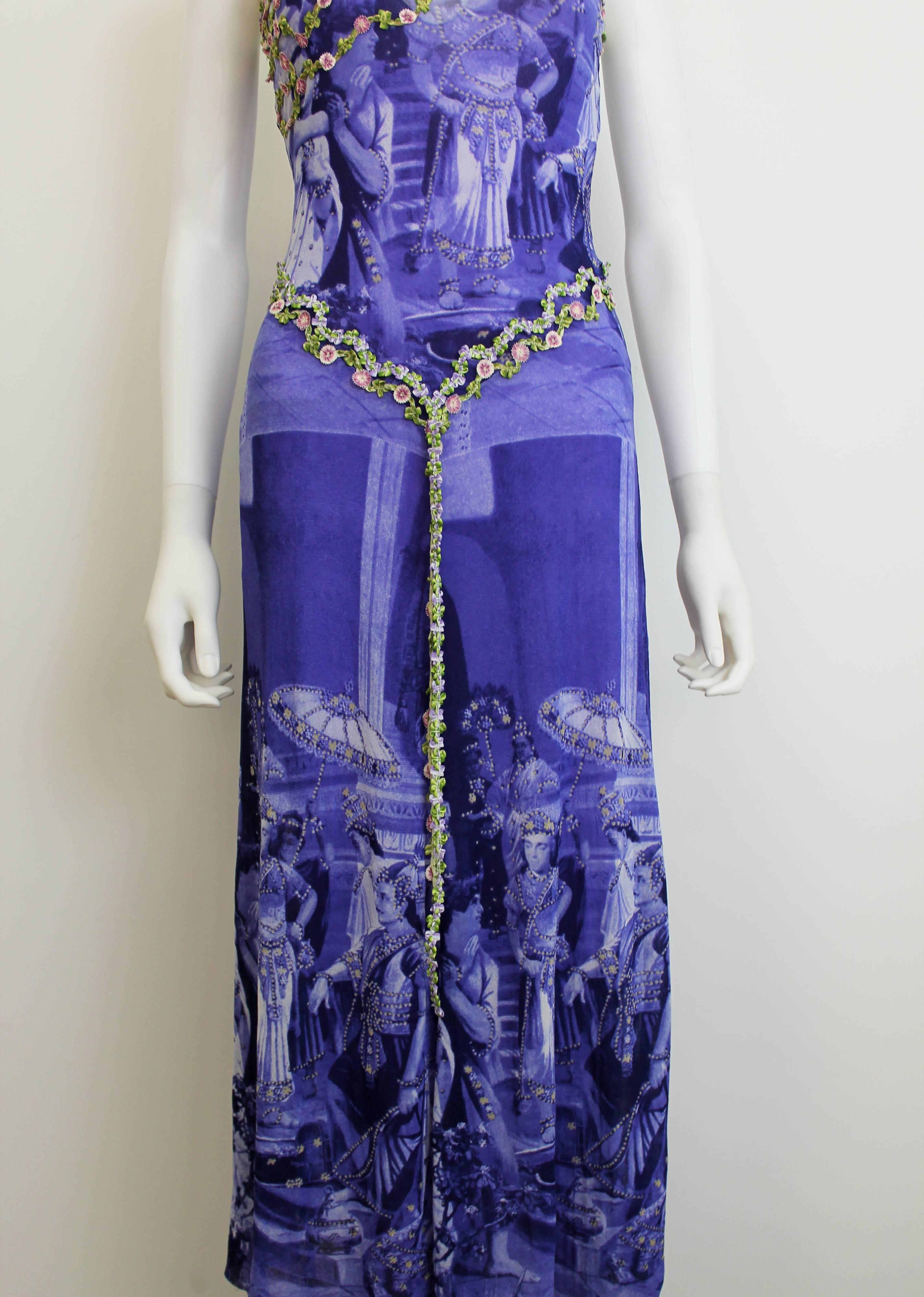 Jean Paul Gaultier purple dress from the mid-1990's. Features flower belt and neckline. Comes with a separate purple slip (also Jean Paul Gaultier, though not the original slip that initially came with the dress).