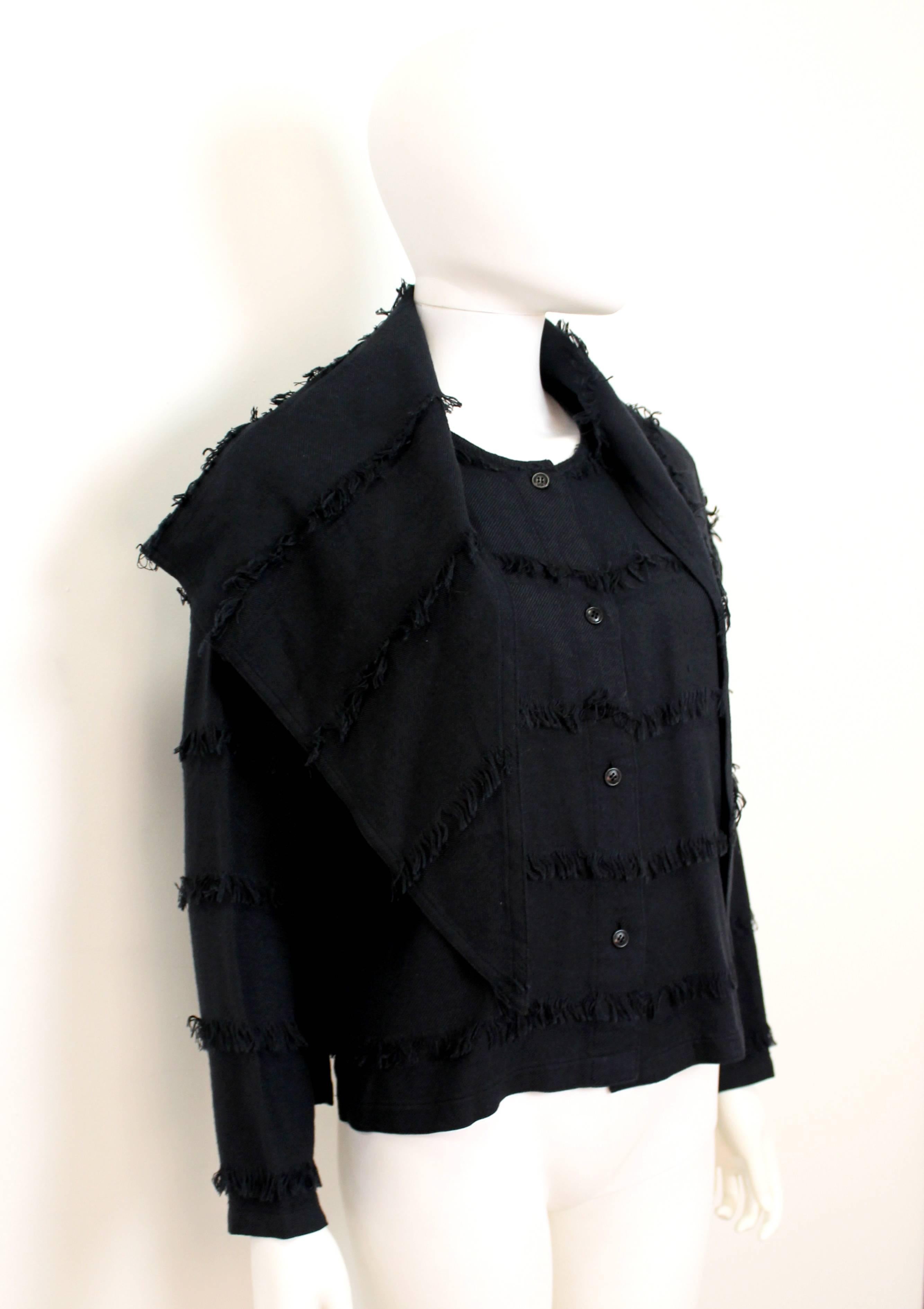Very wearable Issey Miyake fringe jacket from the 1980's.The piece has a removable collar that can be worn in a number of different ways. It also features multiple levels of fringing down the front and back.