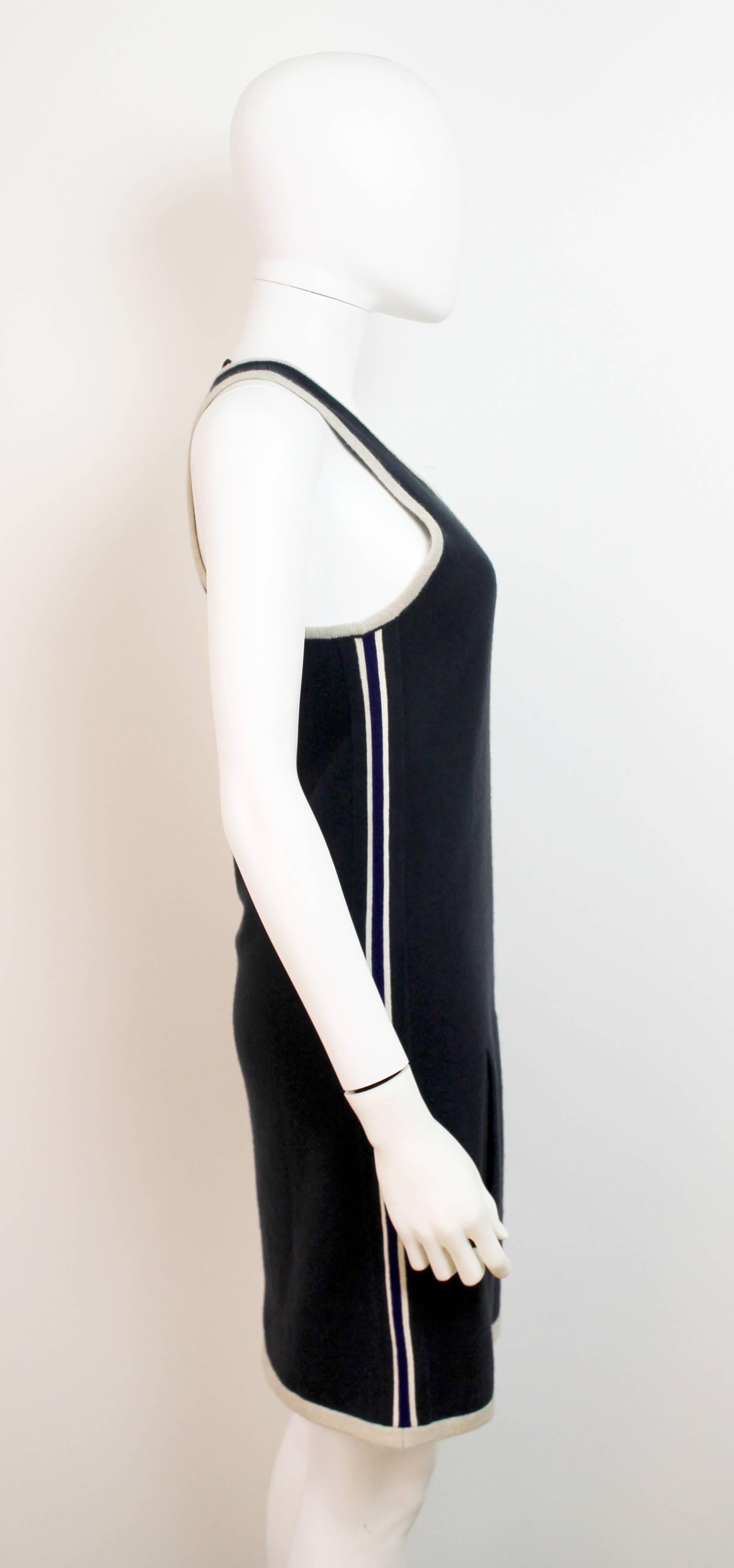 Comfortable black mini cashmere Chanel dress with blue and white sports stripe down the side and front pocket