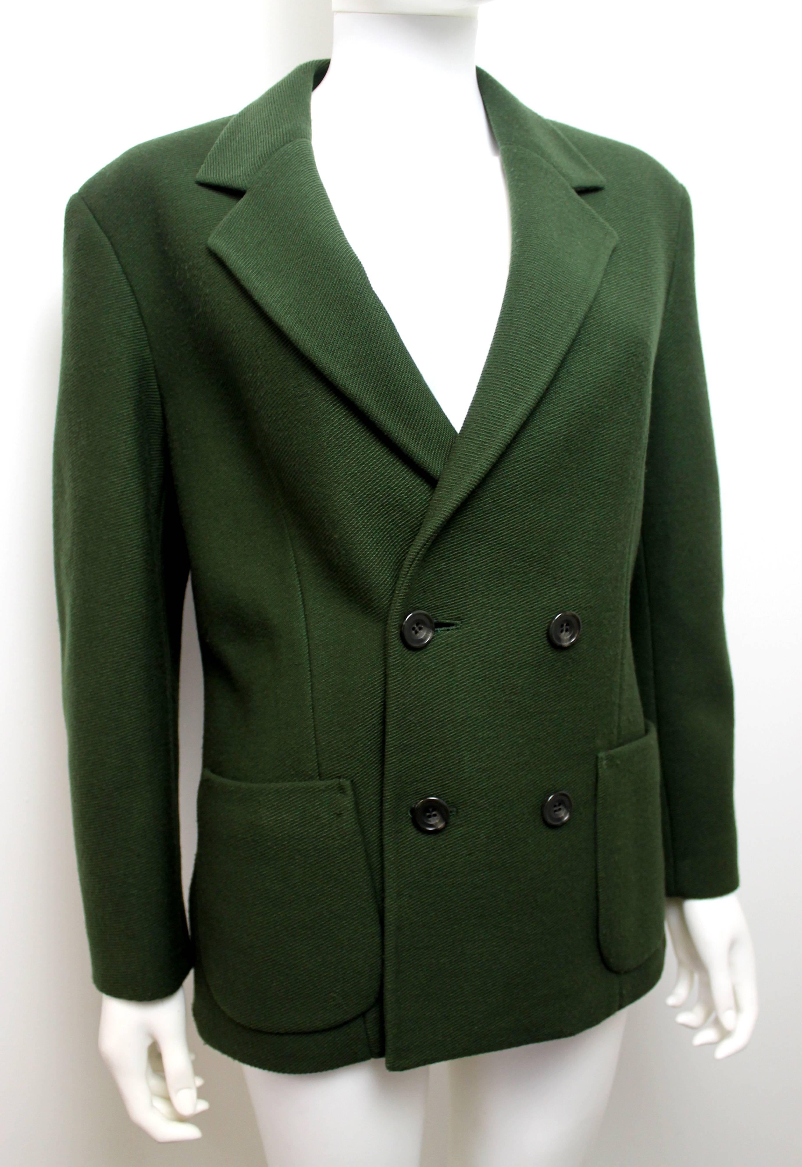 Beautiful green blazer by Yohji Yamamoto. Features two front pockets and four green double breasted buttons. Believed to be from the 1980's.