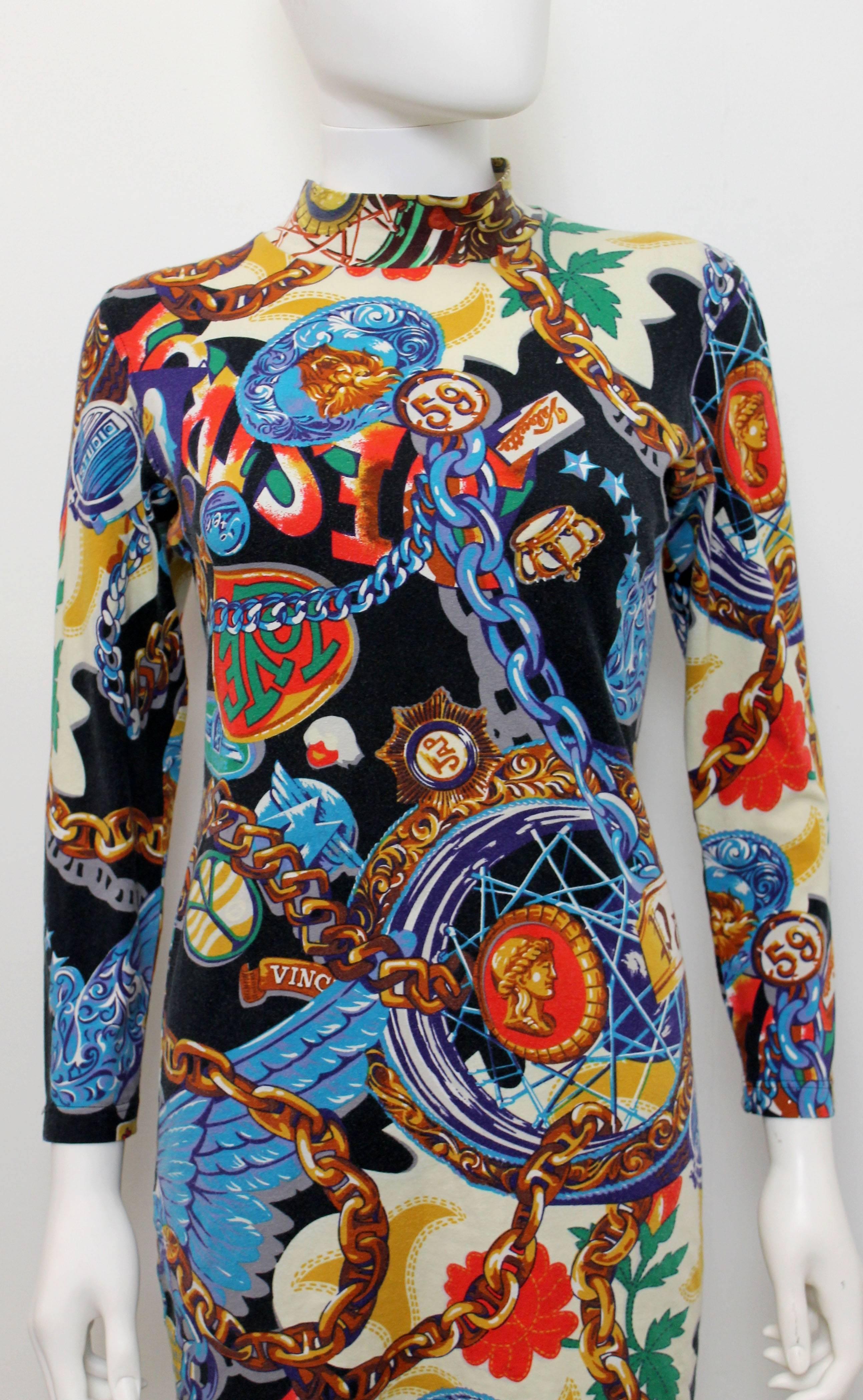 This dress from Kenzos ‘Jungle’ line dates to the late 1980s. The dress features a vibrant contrasting colour palette print featuring police badges, cars, baroque motifs, necklaces, flowers, text and ducks. 
This dress is a great interesting and