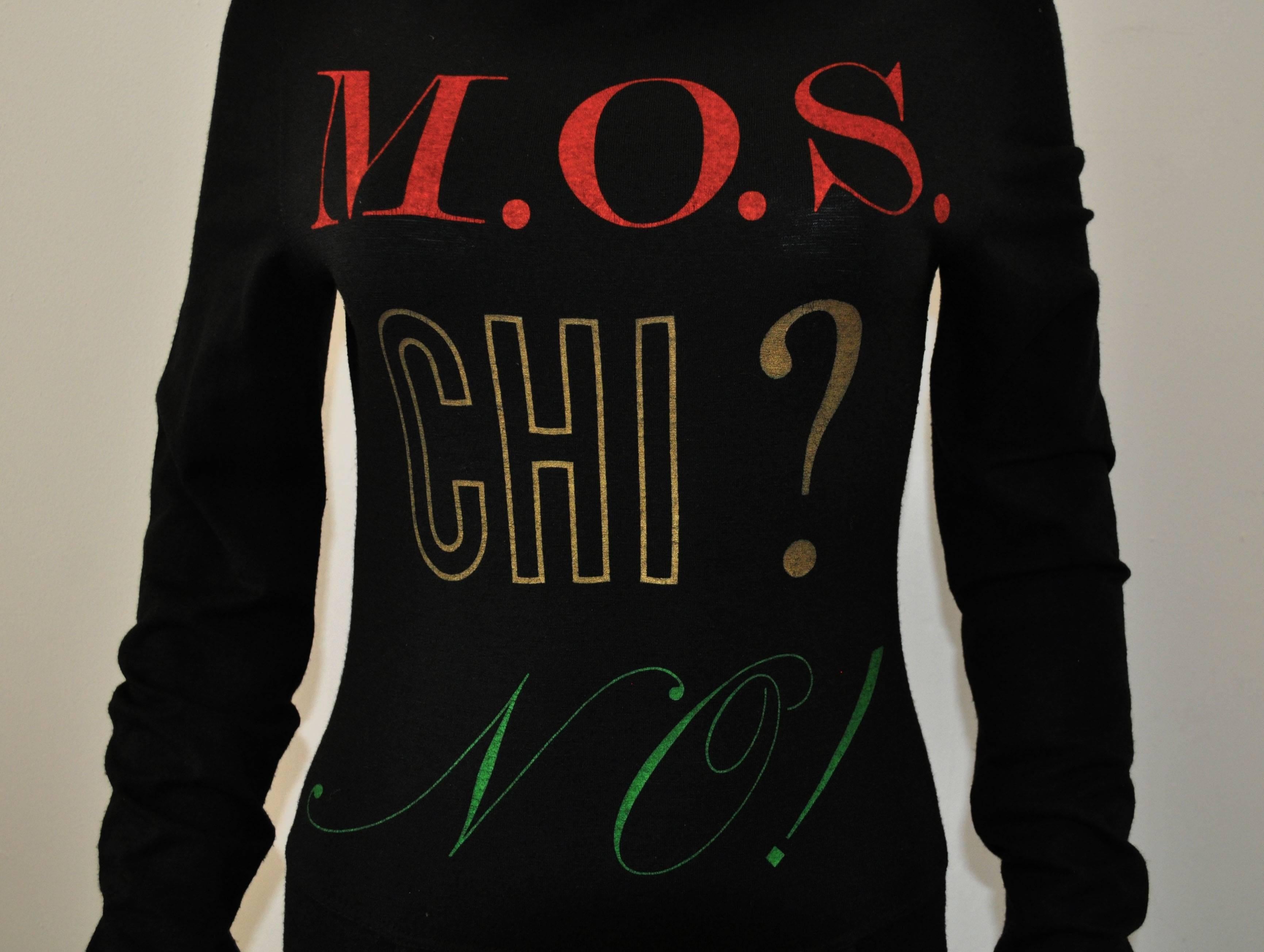 1990’s Black Moschino Jeans long-sleeve body-con dress. The dress has a graphic logo print on the front that reads ‘MOS CHI? NO!’ and two pockets at the hip and at the back with a ‘denim skirt’ style bottom half. The dress has some stretch to it and