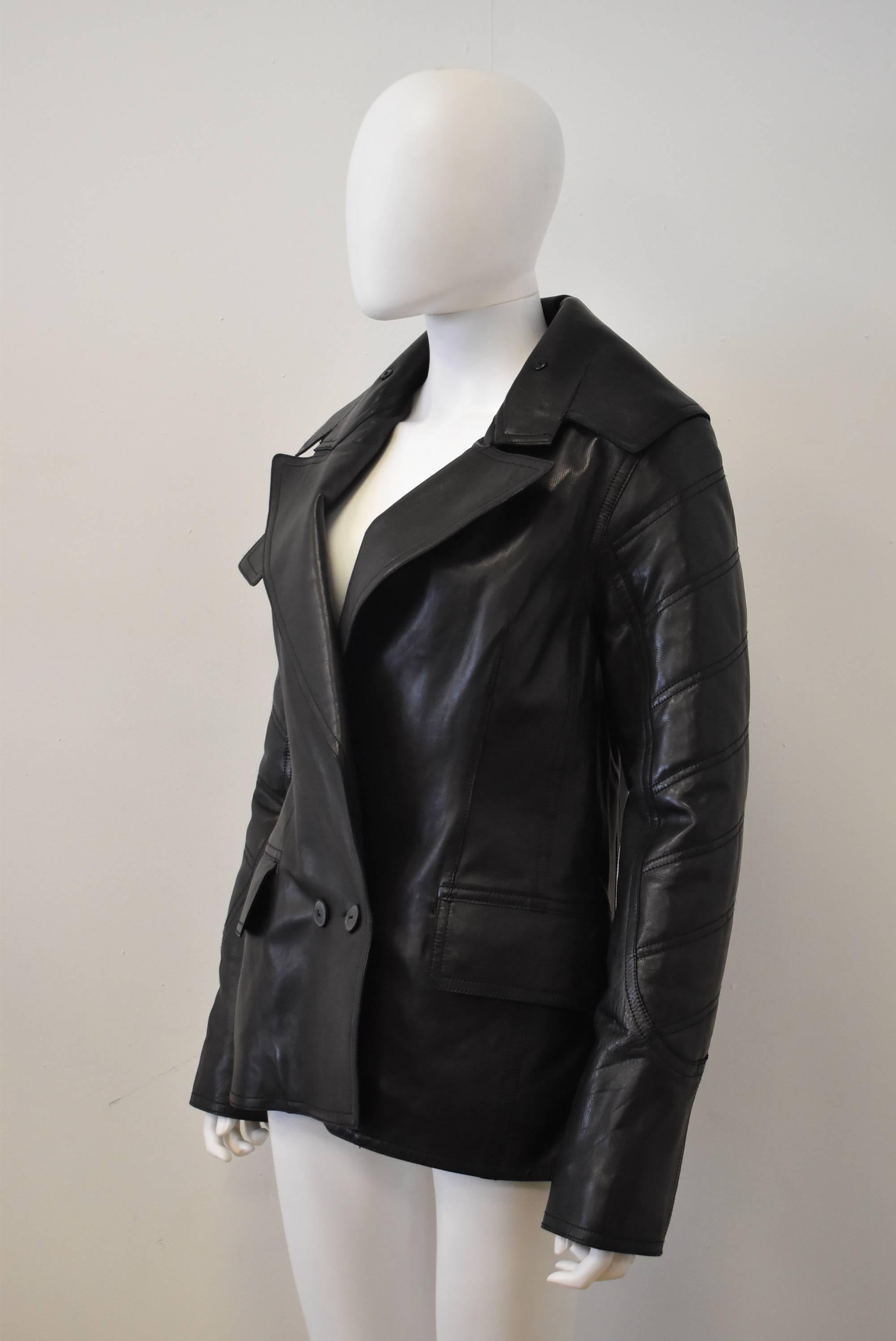 A brand new with tags Alexander Wang leather jacket. The jacket has an oversize biker style shape with quilted sleeves and and oversize collar. There are two pockets on the hip and button fastenings. A twist on a classic design. 
