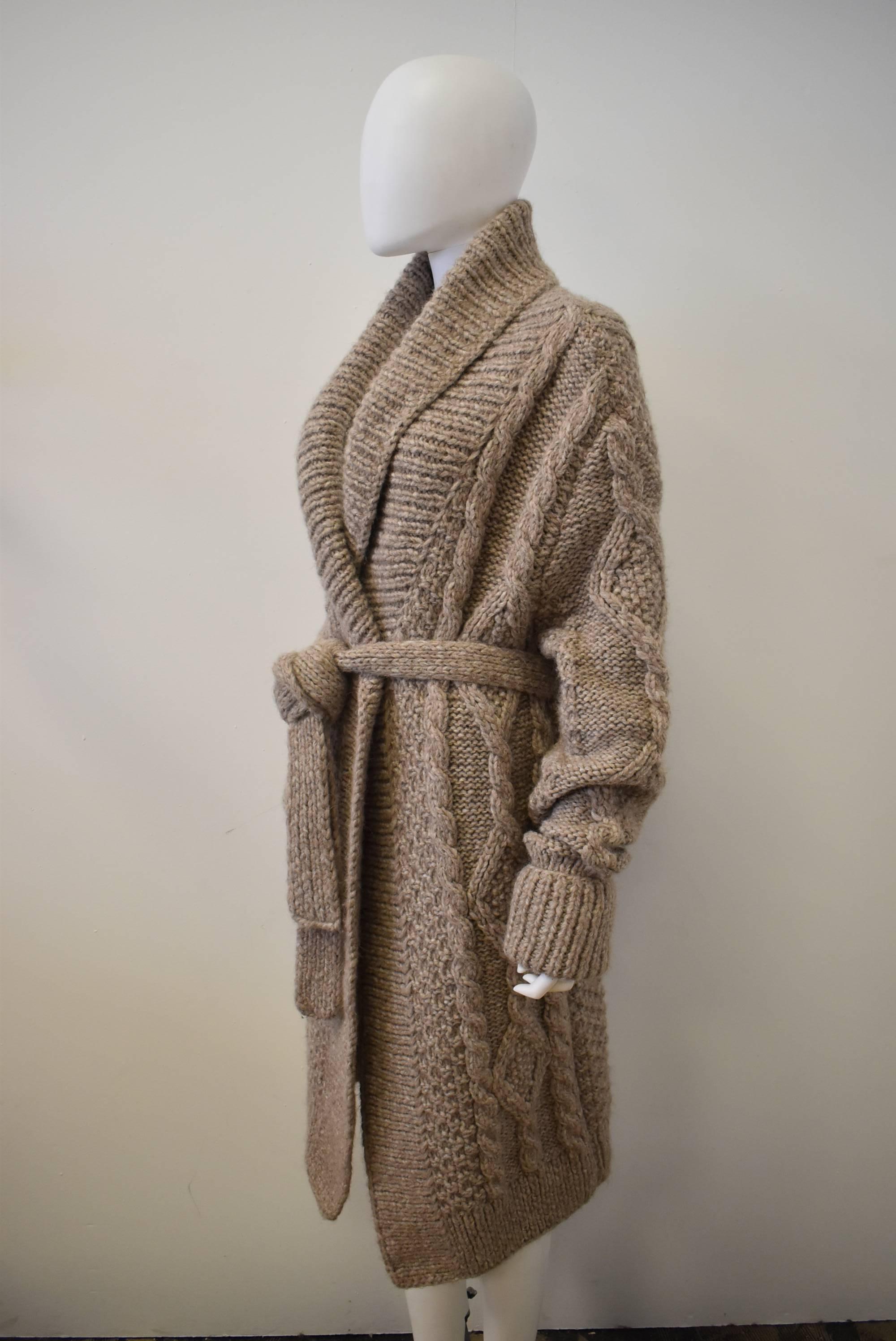 A warm and chunky beige cardigan from Maison Martin Margiela. The knit is from their number 4 'Replica' line, a copy of a French jumper from the 1970's. 