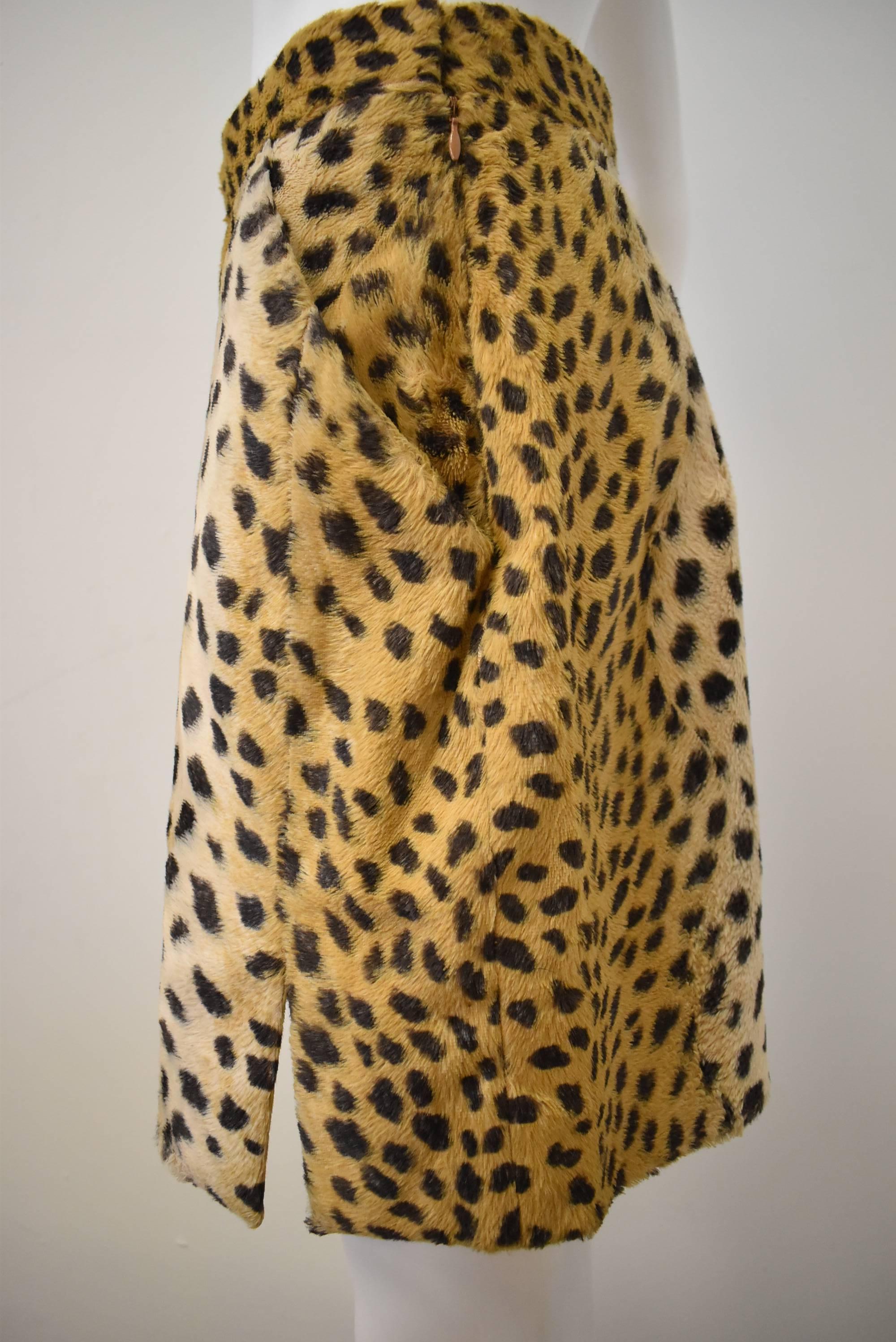  A mini skirt from the late 1990s by Givenchy. This skirt was designed under the creative direction of the late Alexander Mcqueen. The mini skirt is made from a soft short pile faux abstract leopard print featuring two front pockets and 4.5 inch