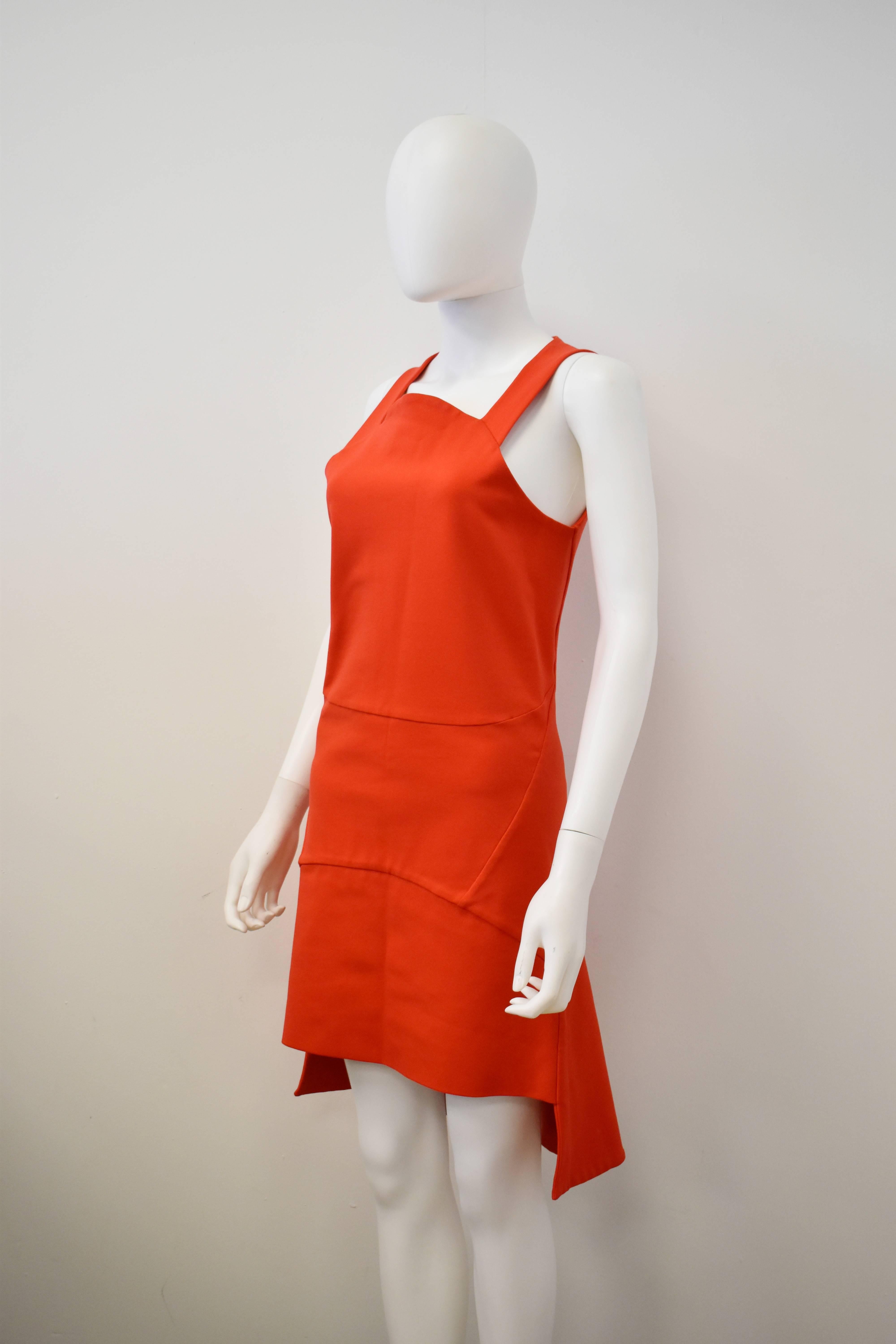 Bright red fitted panel dress by Givenchy with asymmetric hemline. Zip fastening to the back. 