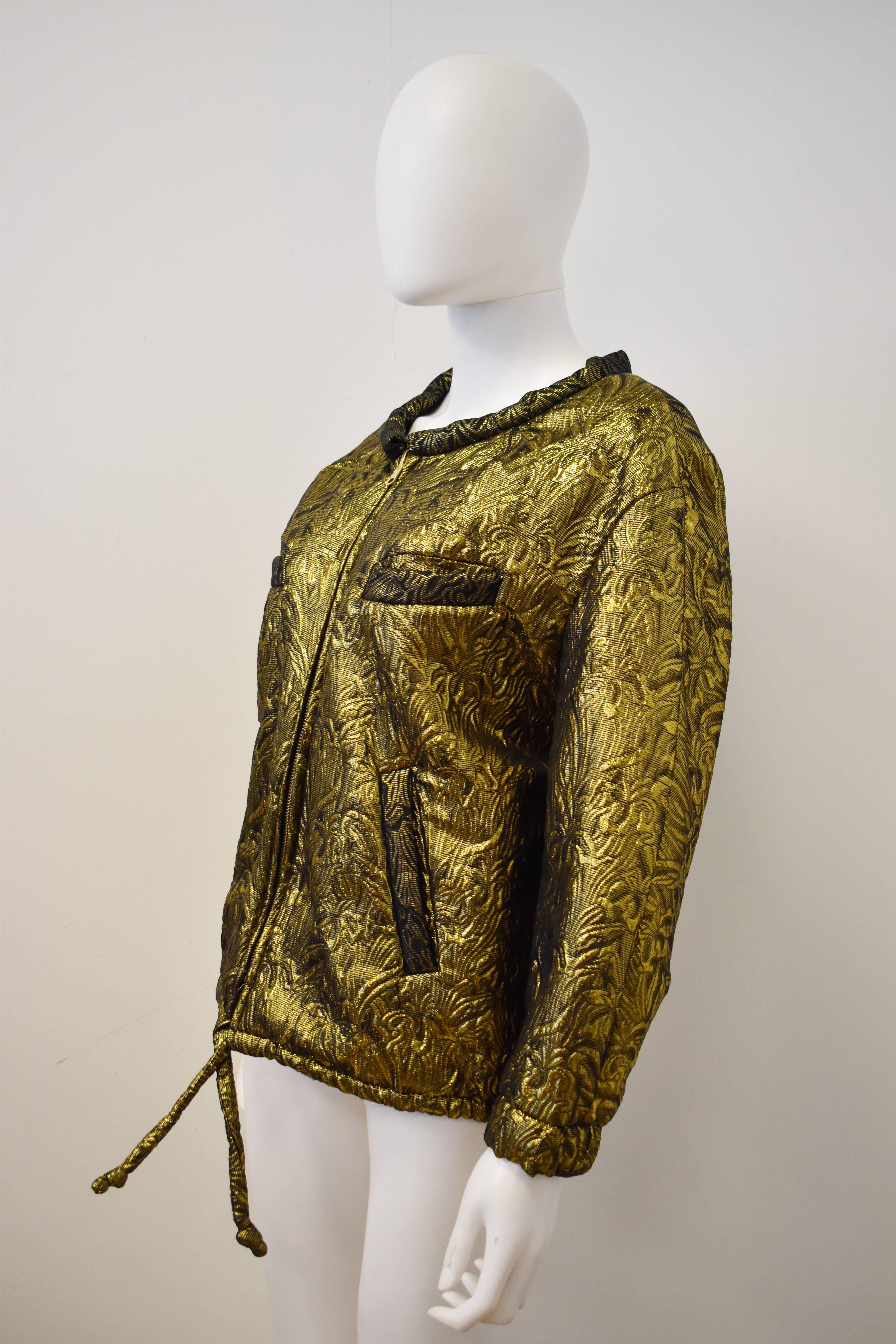 A Isabel Marant gold brocade bomber jacket from Fall 2010. The jacket is reversible. 
