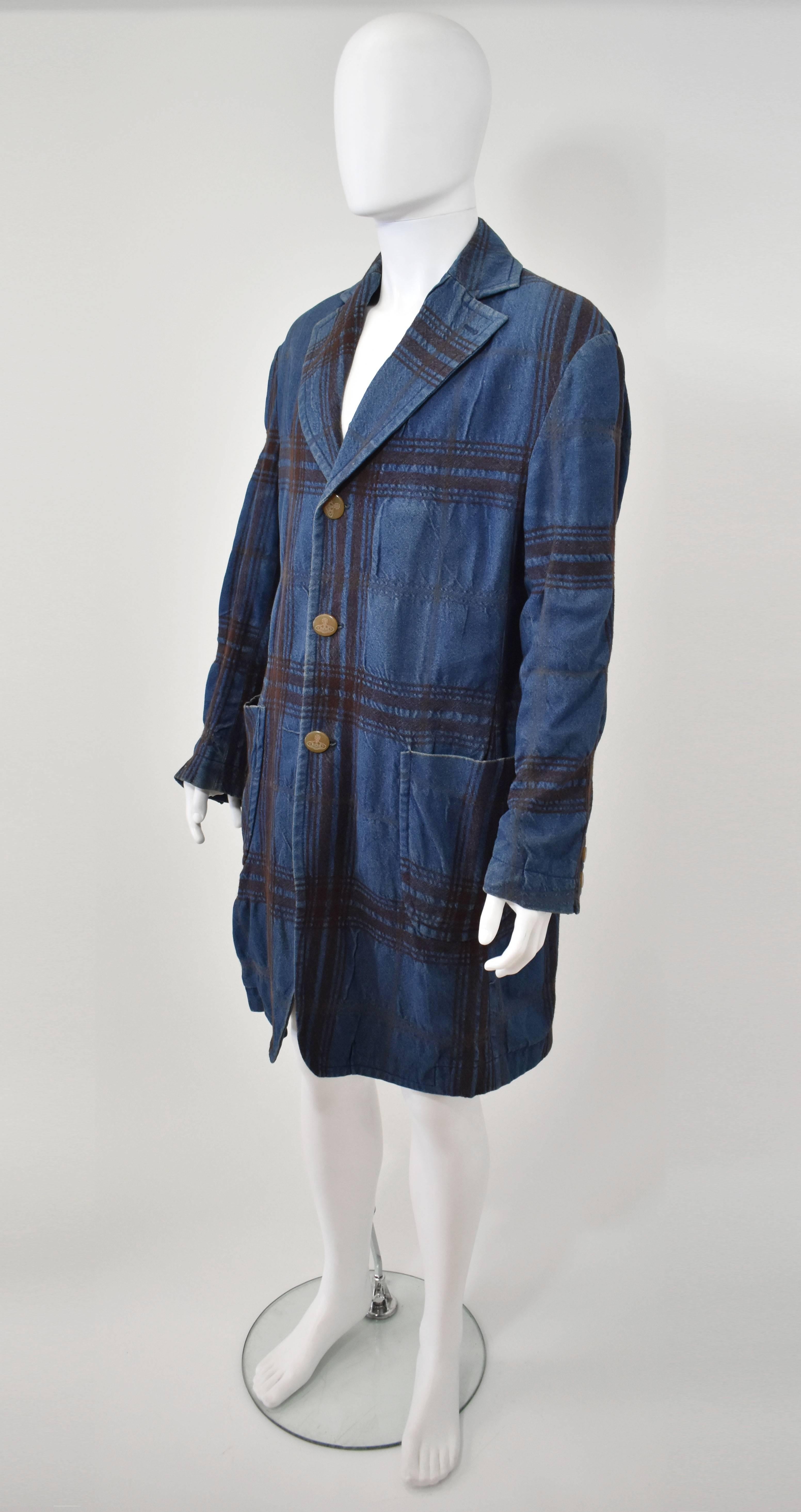 A denim and brown check wool coat with large round pockets by Vivienne Westwood. In excellent condition. 

Length - 43
Bust - 47
Waist - 44
Hips - 47
Sleeve Length - 26.5
