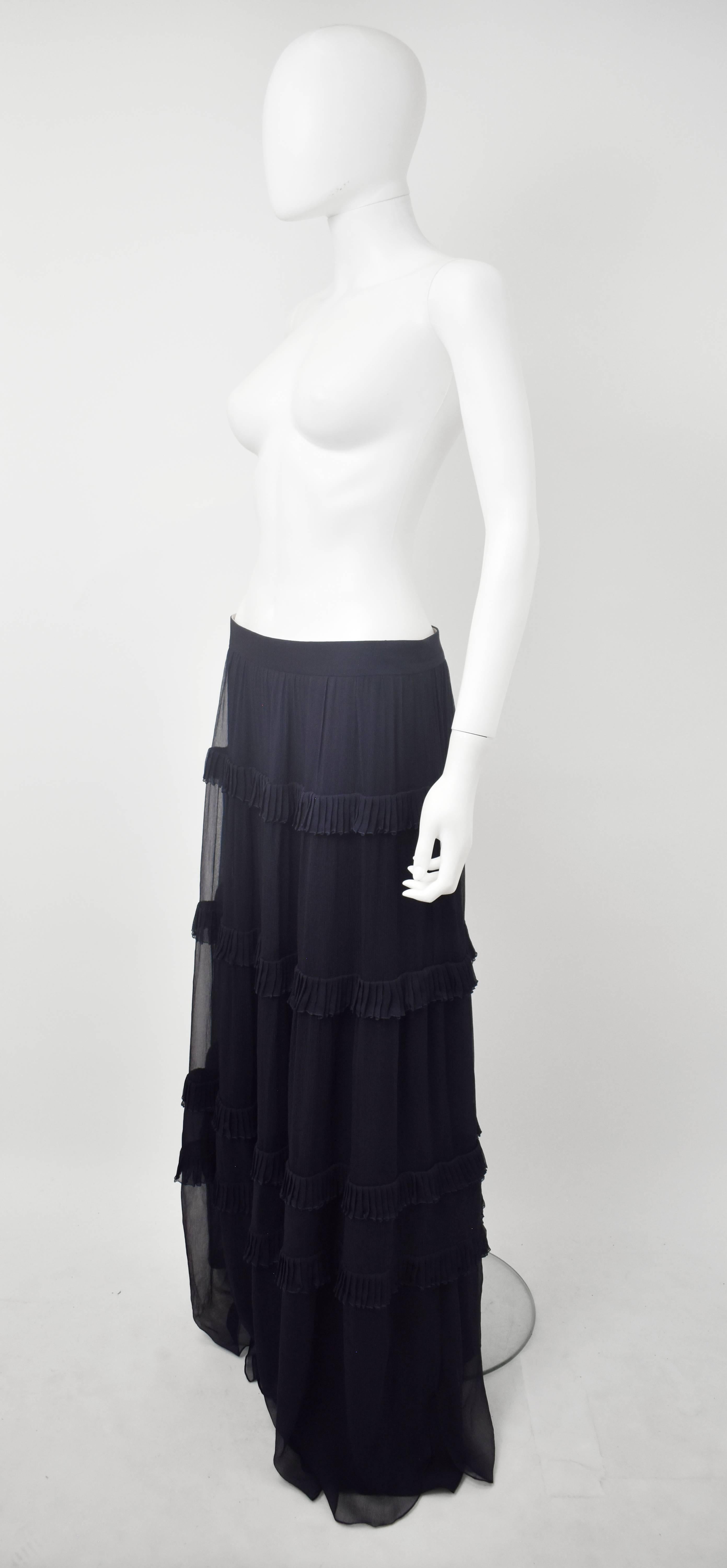 A light and elegant navy blue skirt from French fashion house Chloe. The full-length skirt is made from layers of semi-sheer soft silk that has beautiful, fluid movement. The top layer of the skirt has four tiers with ruffle details along the seams