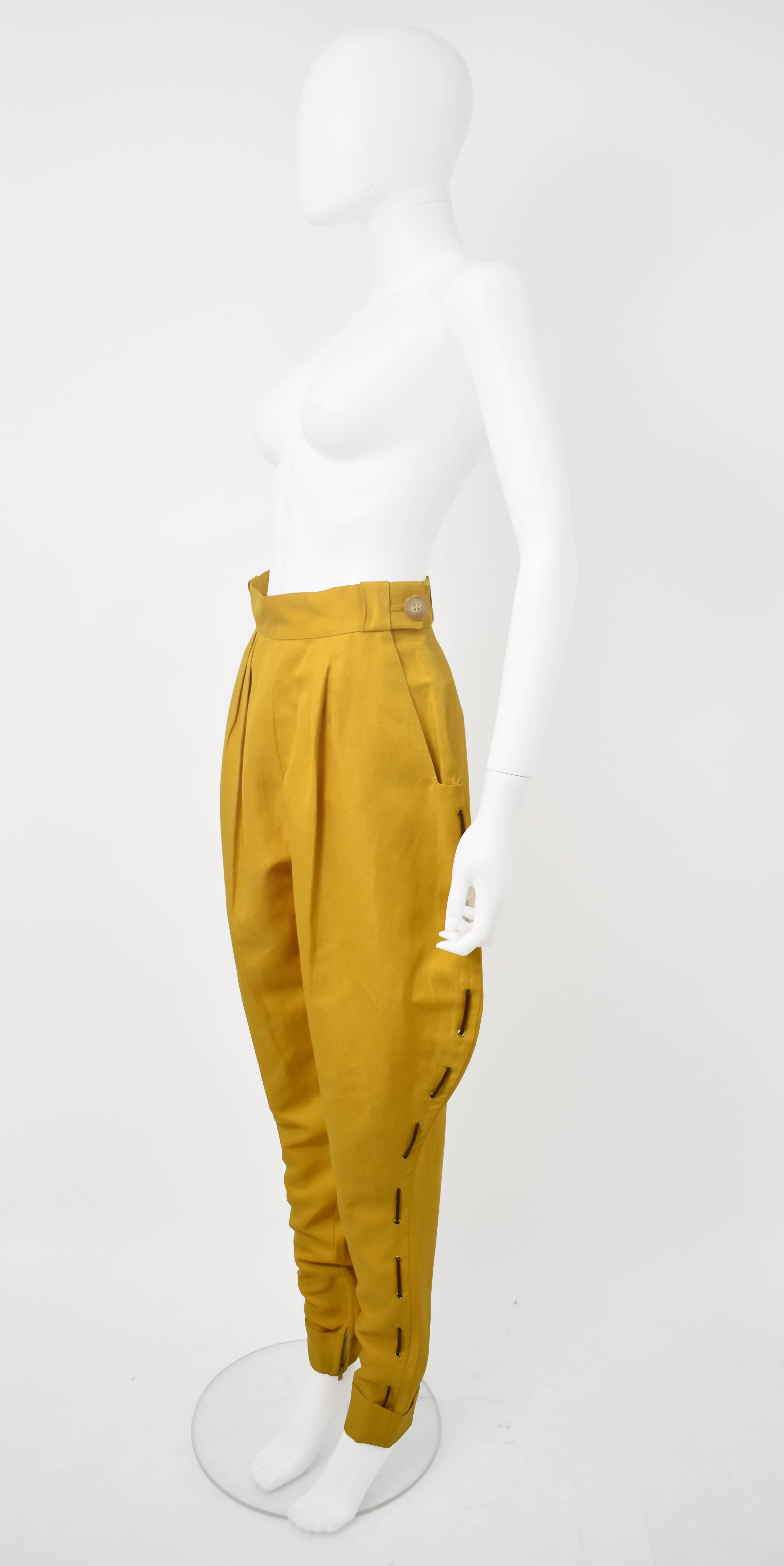 A fantastic pair of mustard yellow jodhpur trousers from luxury fashion house Hermes. The trousers have a traditional jodhpur shape that reference the equestrian heritage of the brand; a hight waist, volume around the hips and thighs and legs that