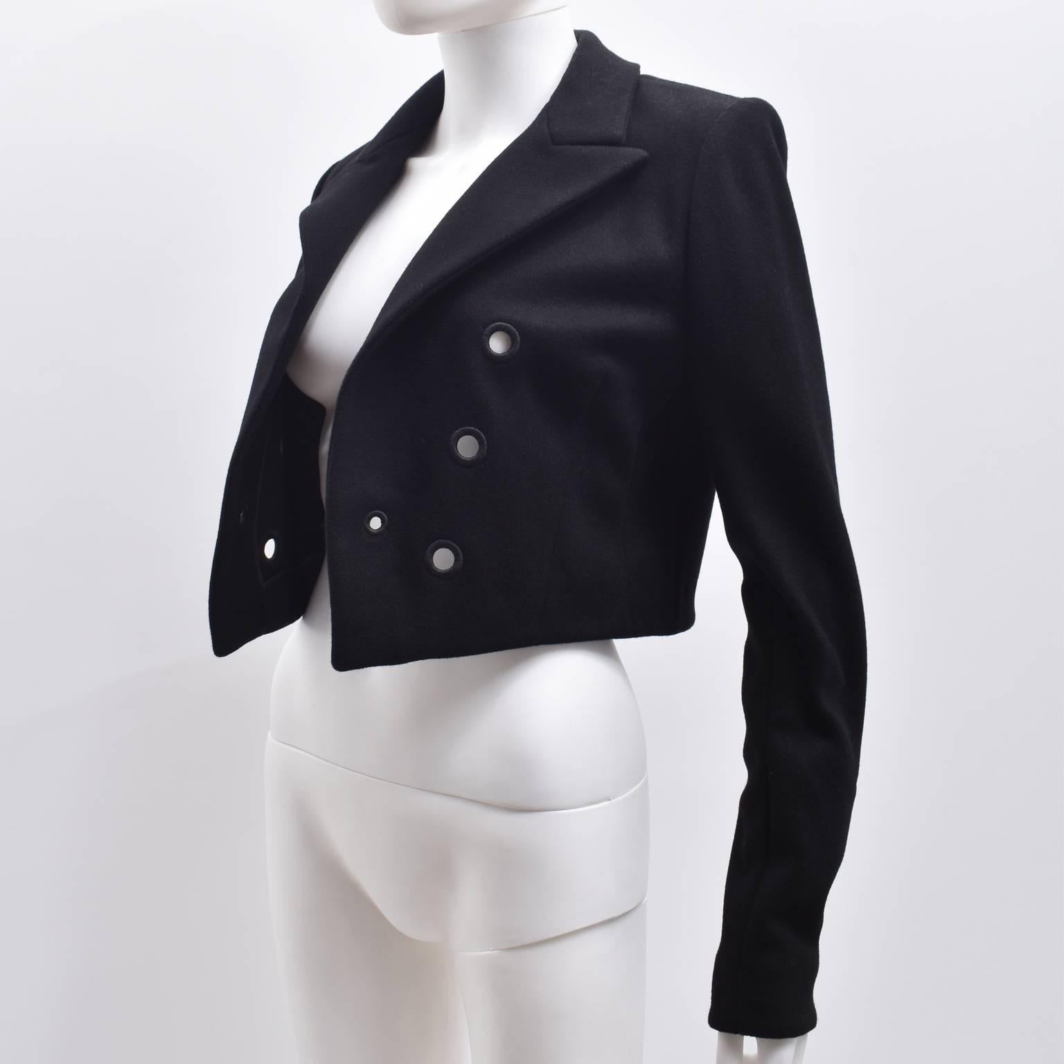 Thierry Mugler Black Wool Cropped Open Jacket with Embroidered Circle Eyelet Details

An elegant black cropped jacket from Thierry Mugler. The jacket has a simple cropped shape with long sleeves and is designed to be worn open like a Bolero. It also