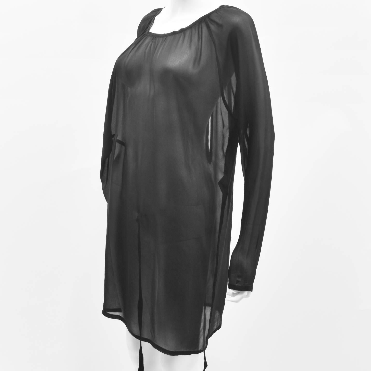 A beautiful black silk multifunction top or dress by Ann Demeulemeester. It has billowing shape that can be worn as an oversized sheer dress, but it also has two ties inside at the front and back which can be used to create a twisted seam,