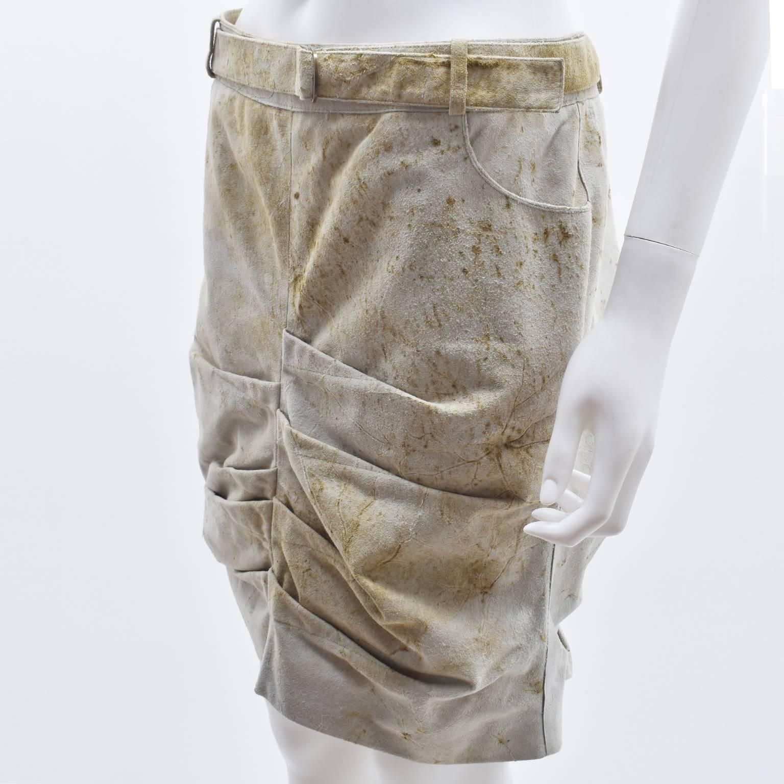 A rare Christian Dior leather mini skirt from the 00’s designed by John Galliano. The skirt is made from calfskin which has a suede-like texture and has been treated to have a distressed and worn aesthetic. The seat of the skirt also features a