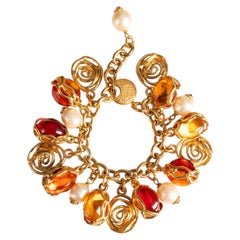 Bracelet à breloques Saint Laurent signé Yves Saint Laurent, vers 1990